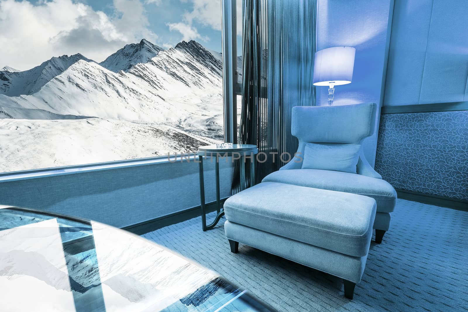 Sofa in living room in Snow Moutain Background