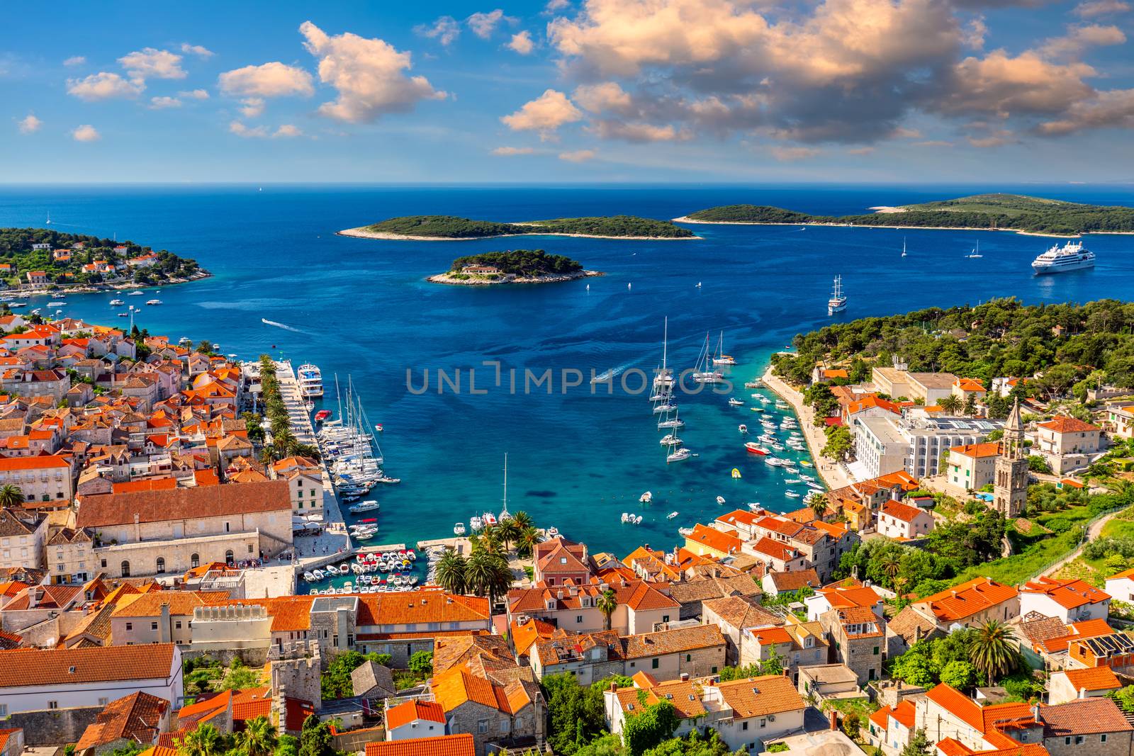 View at amazing archipelago in front of town Hvar, Croatia. Harbor of old Adriatic island town Hvar. Popular touristic destination of Croatia. Amazing Hvar city on Hvar island, Croatia.
