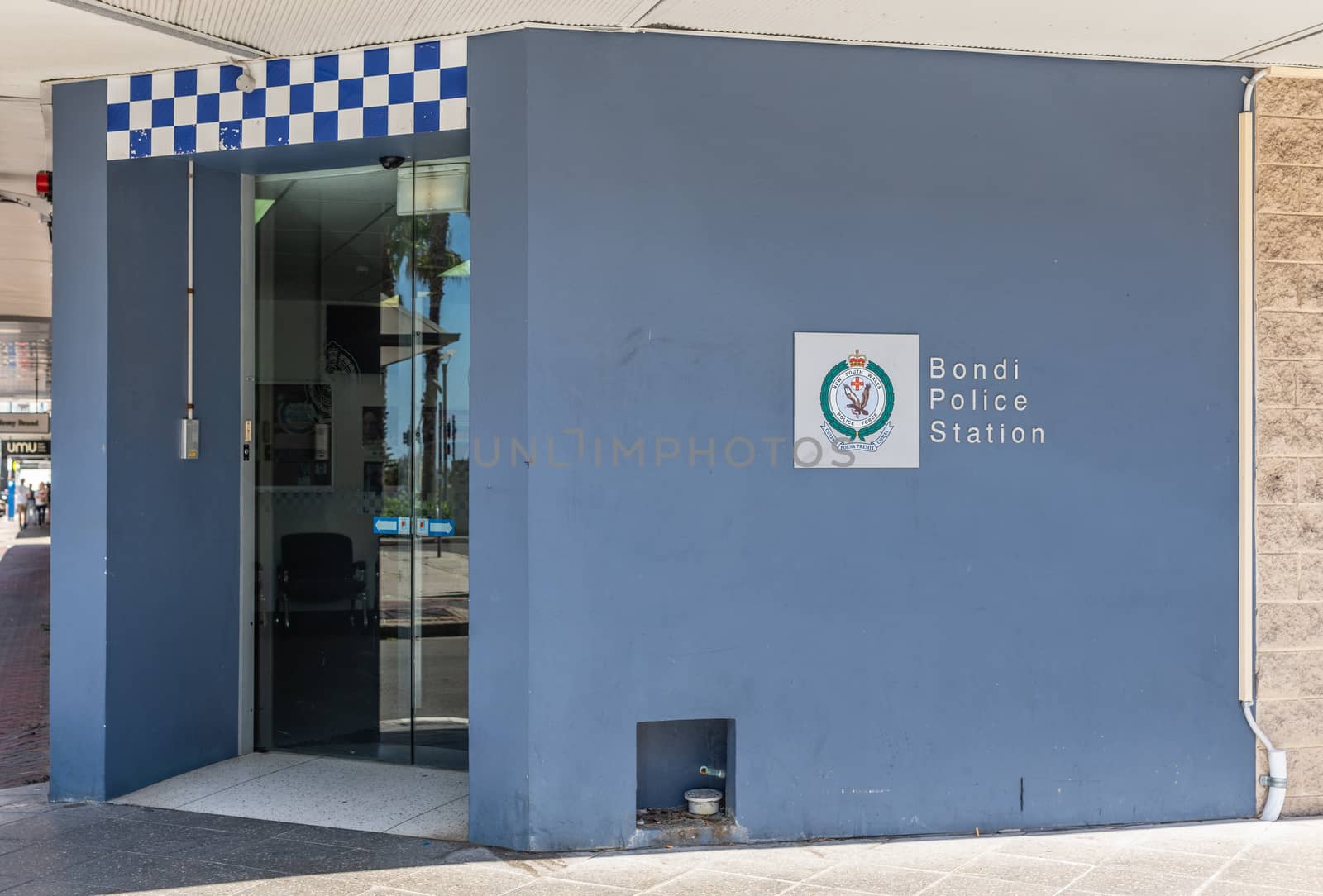 Sydney, Australia - February 11, 2019: Police Station of Bondi Beach with light blue facade, emblem, and front door.