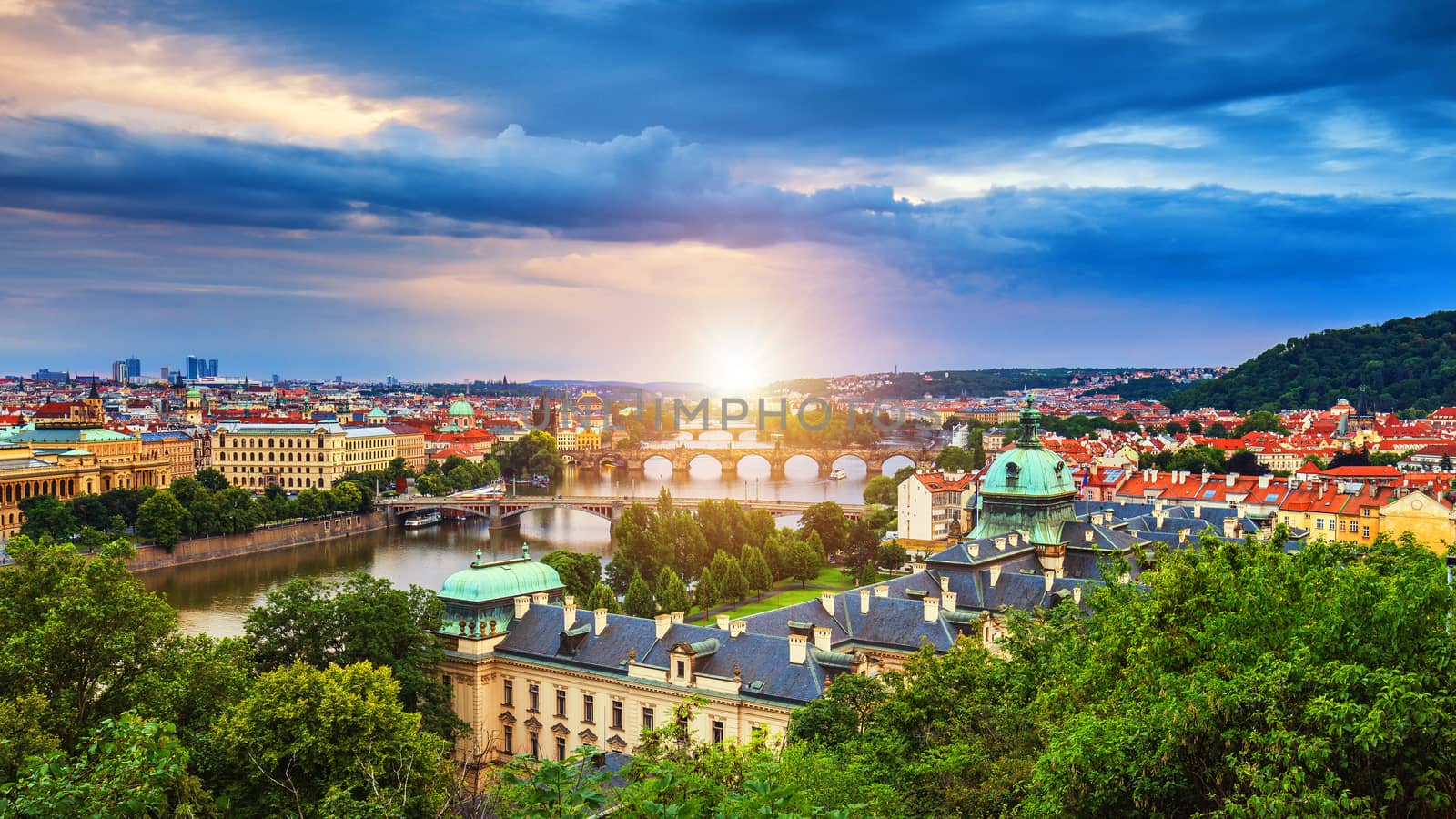Scenic spring sunset aerial view of the Old Town pier architecture and Charles Bridge over Vltava river in Prague, Czech Republic
