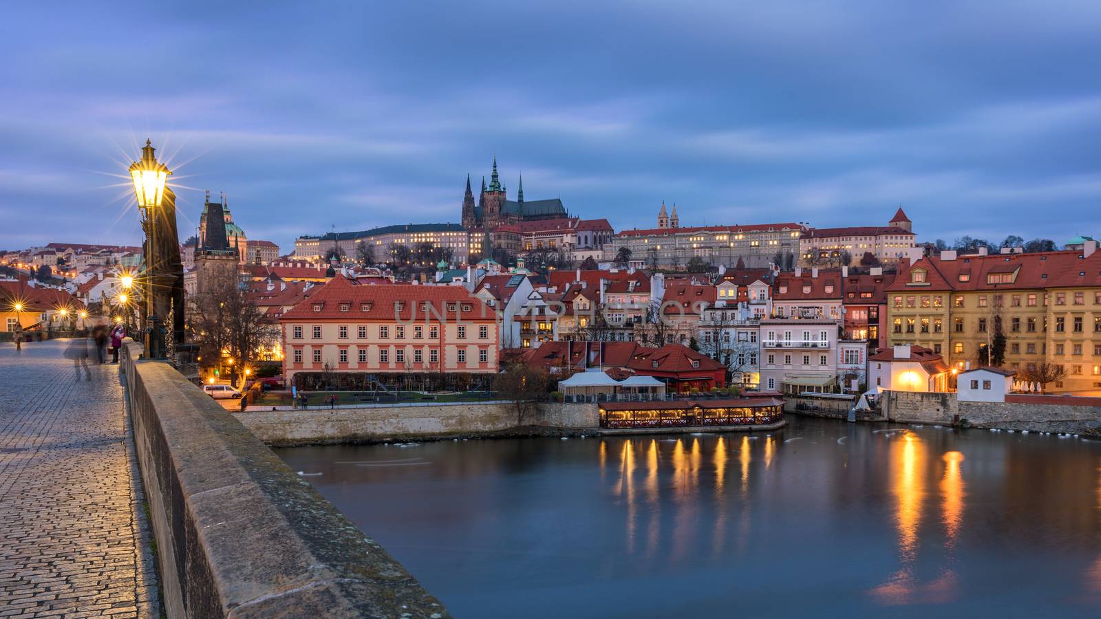 Morning view of Charles Bridge in Prague, Czech Republic. The Charles Bridge is one of the most visited sights in Prague. Architecture and landmark of Prague