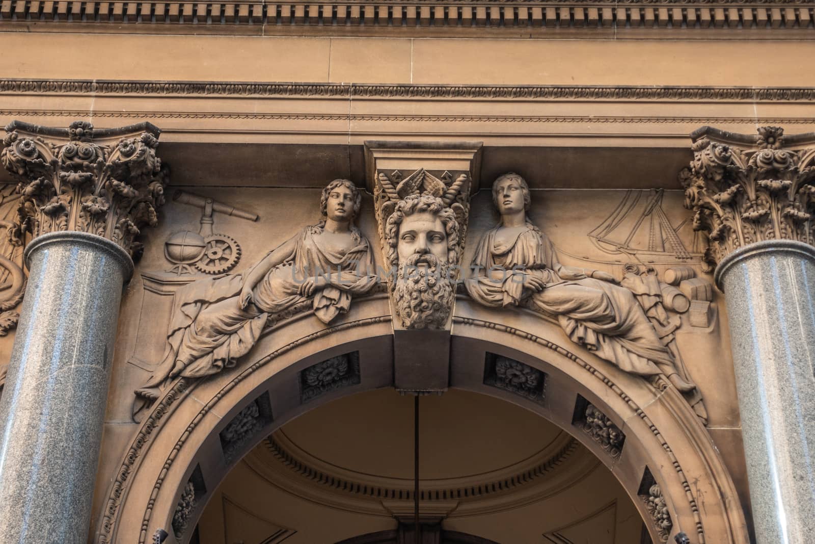 Sydney, Australia - February 12, 2019: Historic and Iconic General Post Office building facade on corner of Martin Place and , George Street. Classical alegorical figures statue above spandrel.