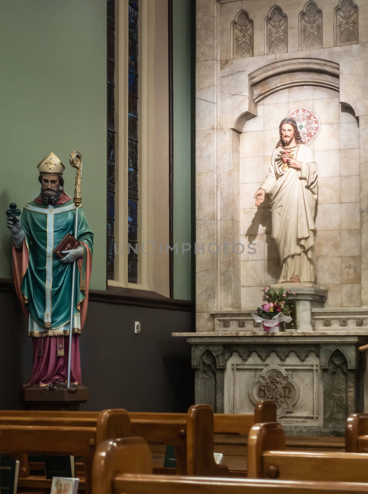 Sydney, Australia - February 12, 2019: Inside Saint Patricks Church on Grosvenor Street opposite of Lang Park. Saint Patrick and Sacred Heart statues.