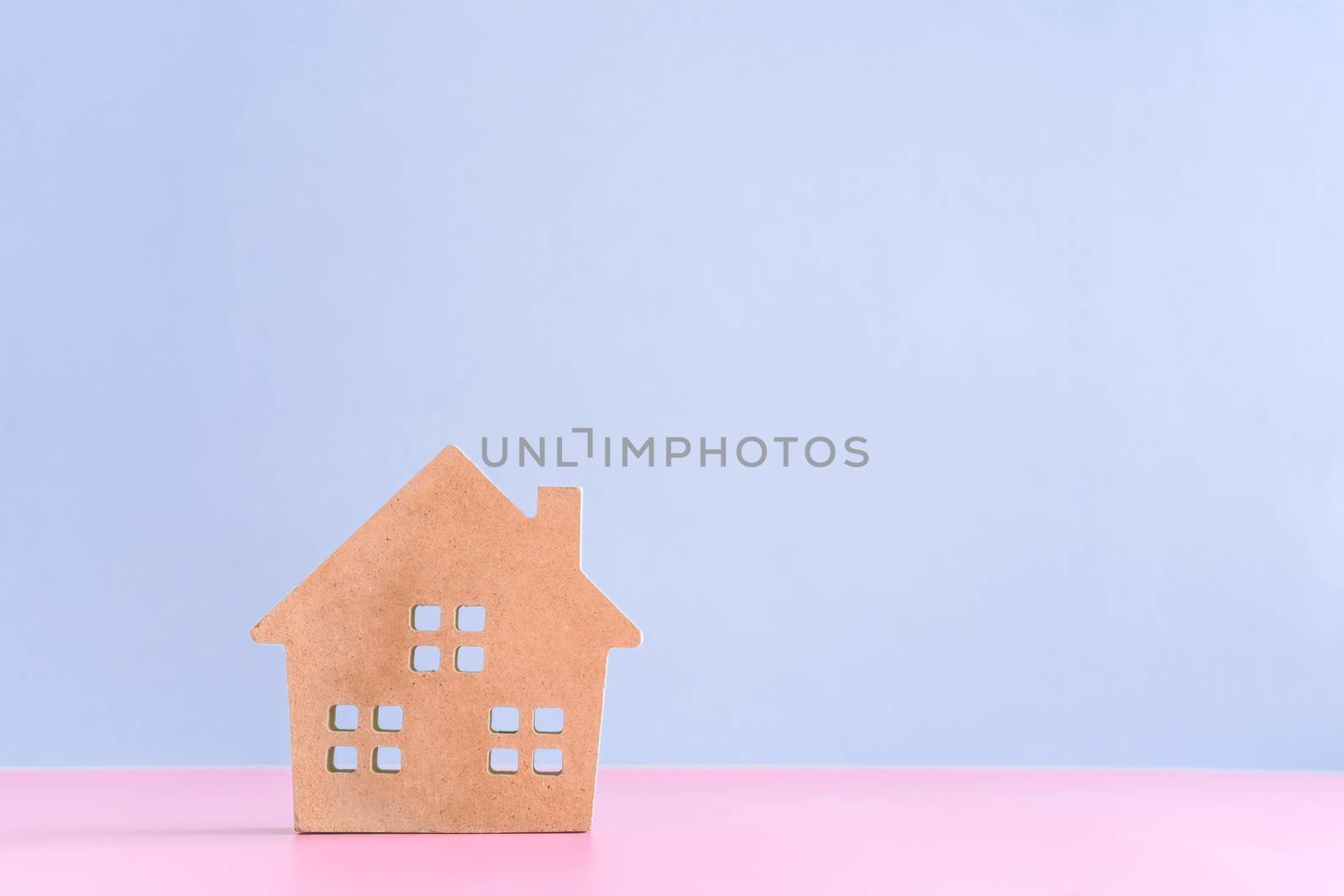 Home or house model in pastel color room background. Investment wealthy freedom life concept.