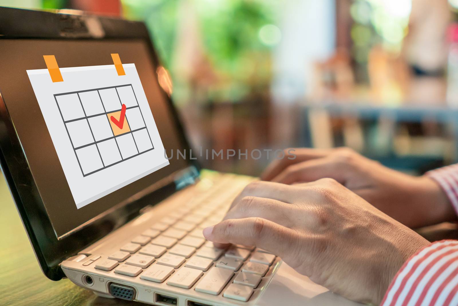 Woman hand using laptop to work study on work desk with plan schedule icon background background. Business, financial, trade stock maket and social network concept.