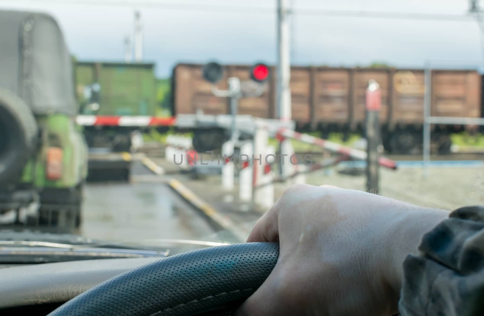 The driver waits for the freight train to pass by jk3030