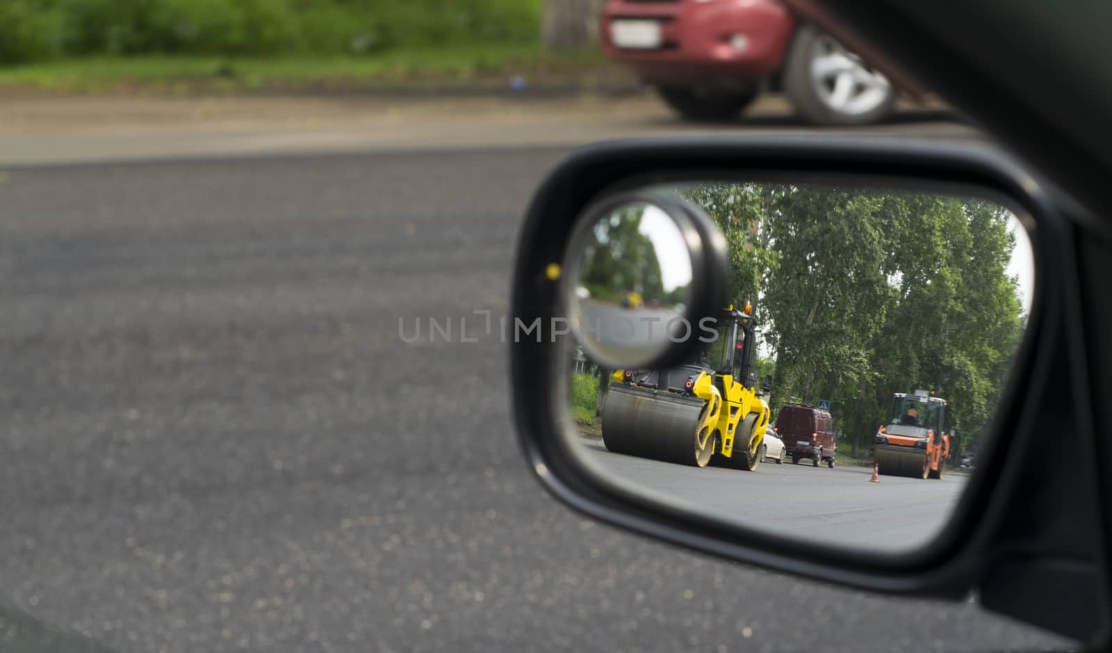 the reflection in the mirror of the repair of the road by jk3030