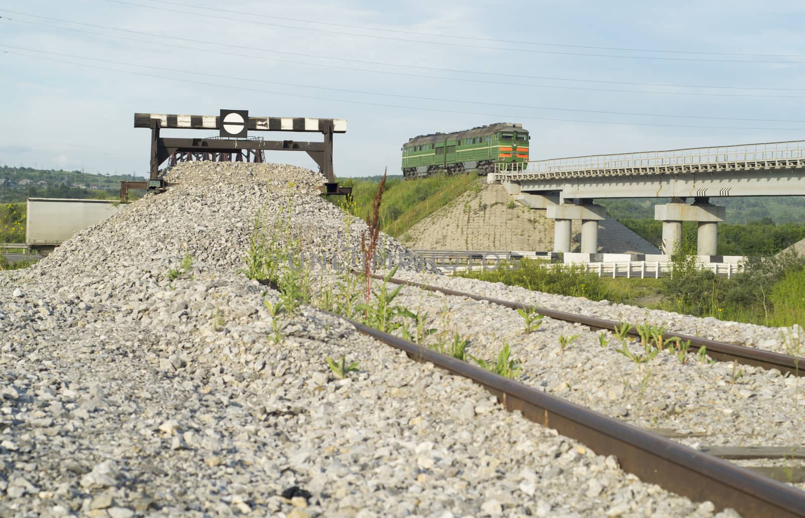 Railway impasse on the railroad tracks. View of the bridge with a railway locomotive
