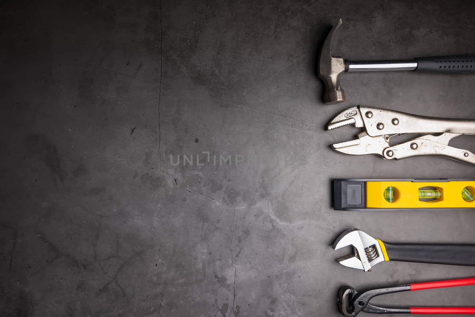 Home Repair Hand Tools on a cement gray background. Concept home by Bubbers