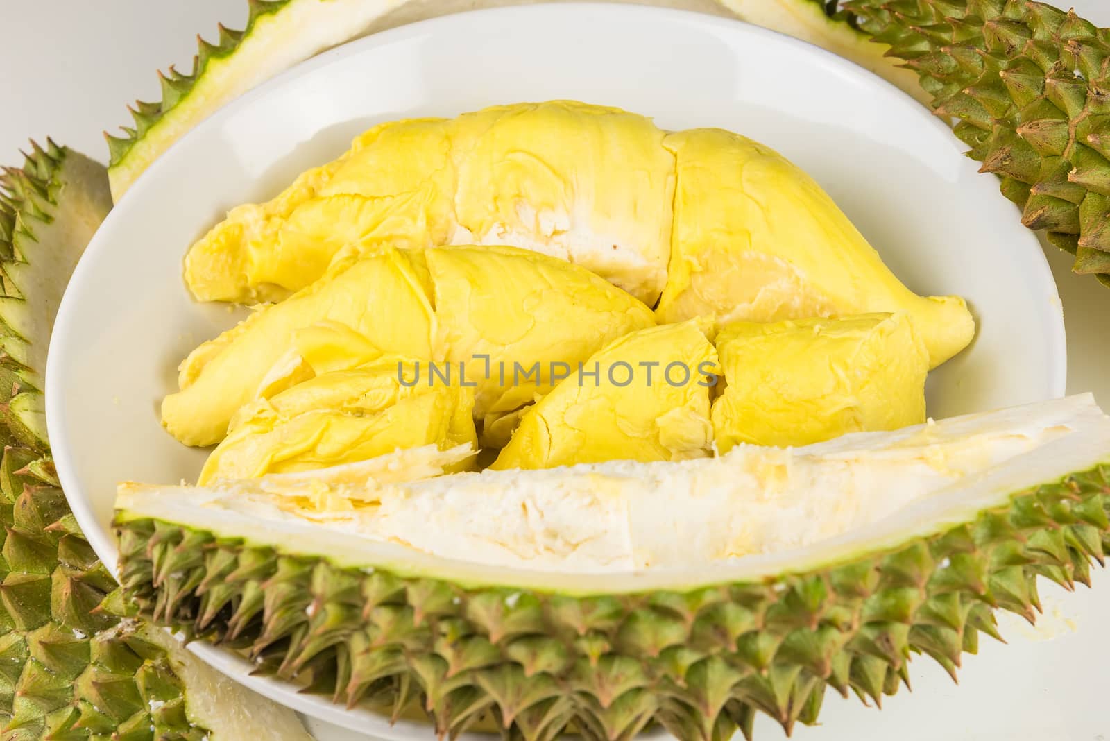 Durian mon thong is king of fruits durian and durian peeled fruit plate tropical durian on white background healthy durian fruit food isolated