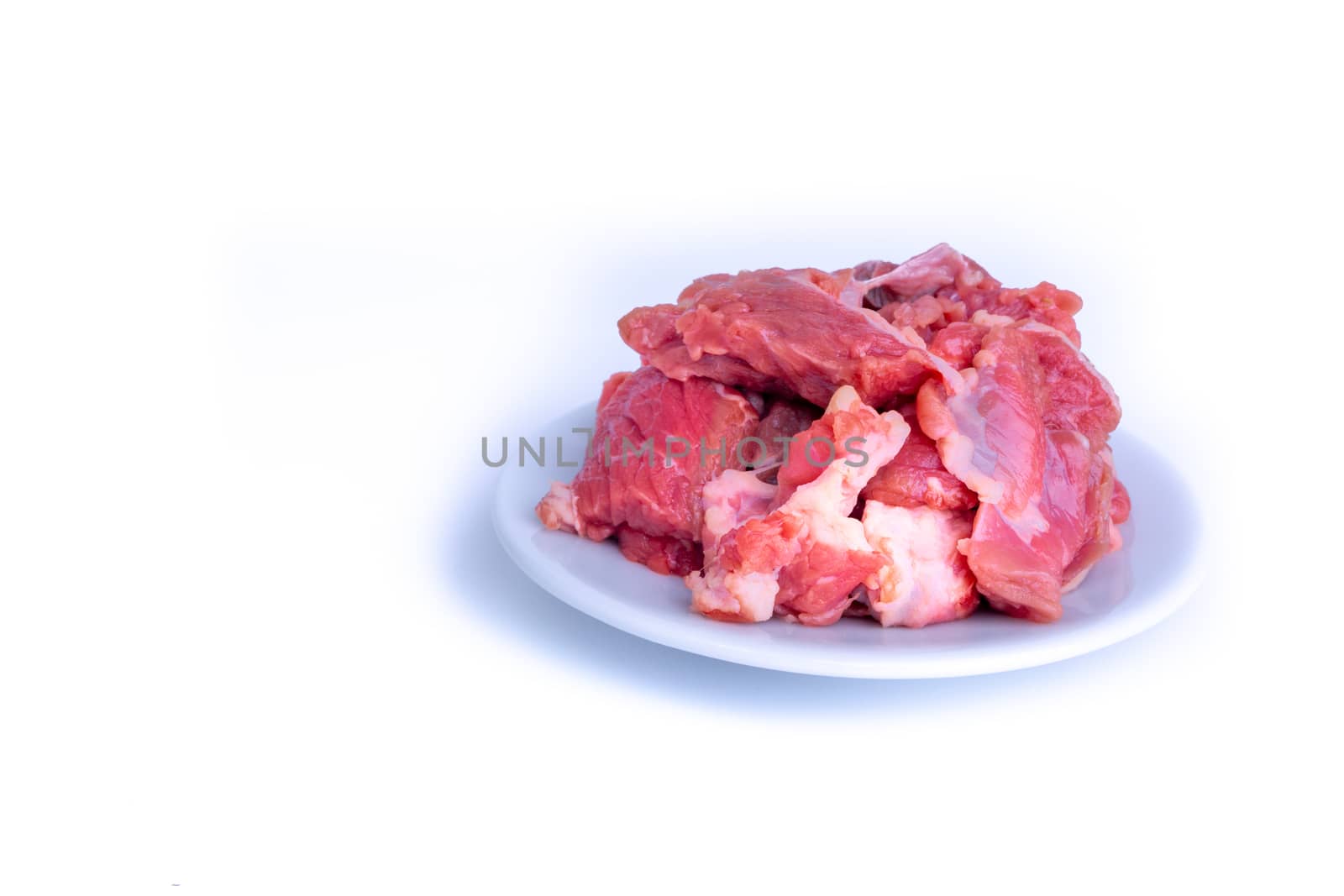 Fresh raw beef steak isolated on white background with selective focus