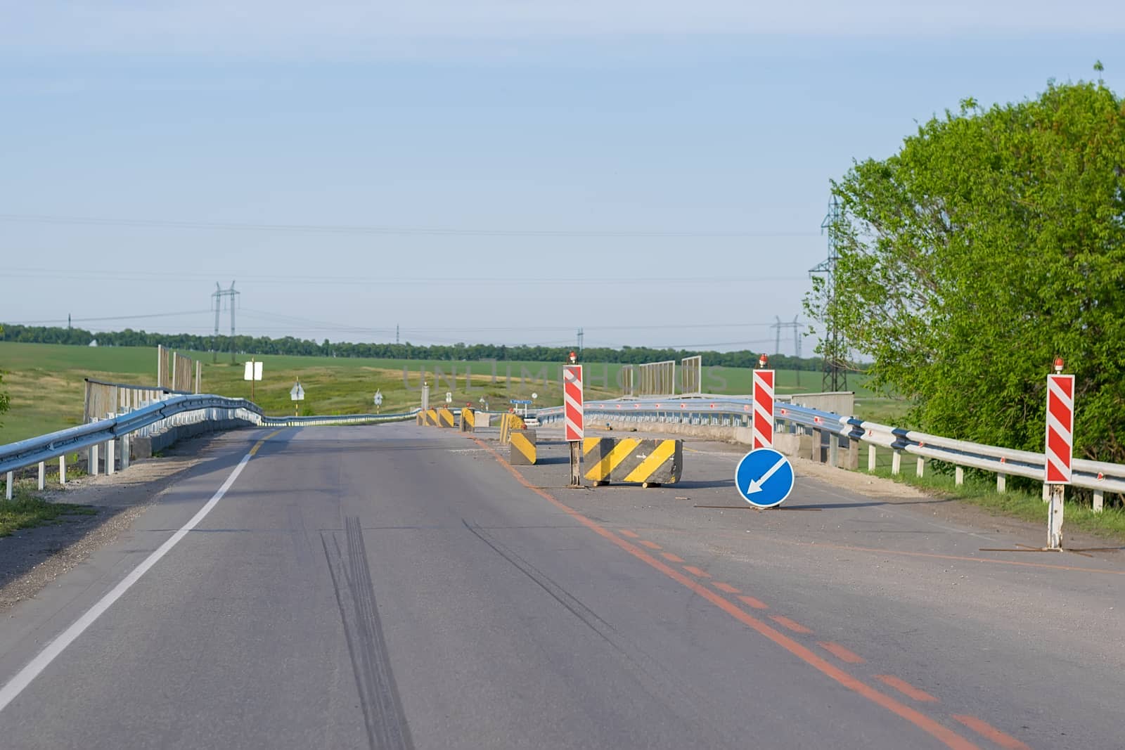 Road signs, detours, repairs, narrowing of the road on the paved road on the highway