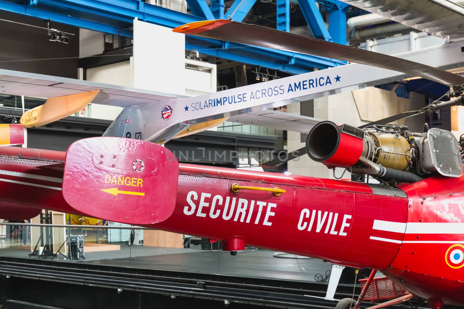 Paris, France - October 6, 2018 - Old Red Helicopter of Civil Security exhibited at the entrance of the City of Science and Industry during the Science Festival