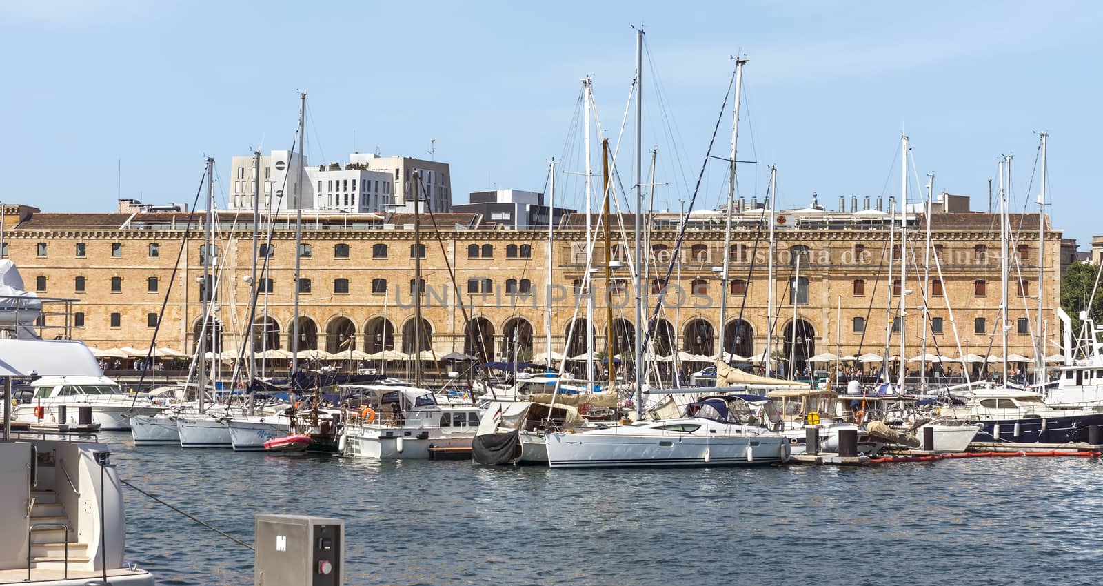 BARCELONA, SPAIN - JULY 4, 2015: The building "Palau de Mar" (1880-1890) home of museum "Museu d'Historia de Catalunya" in front of the harbor.

Barcelona, Spain - July 4, 2015: The building "Palau de Mar" (1880-1890) home of museum "Museu d'Historia de Catalunya" in front of the harbor.