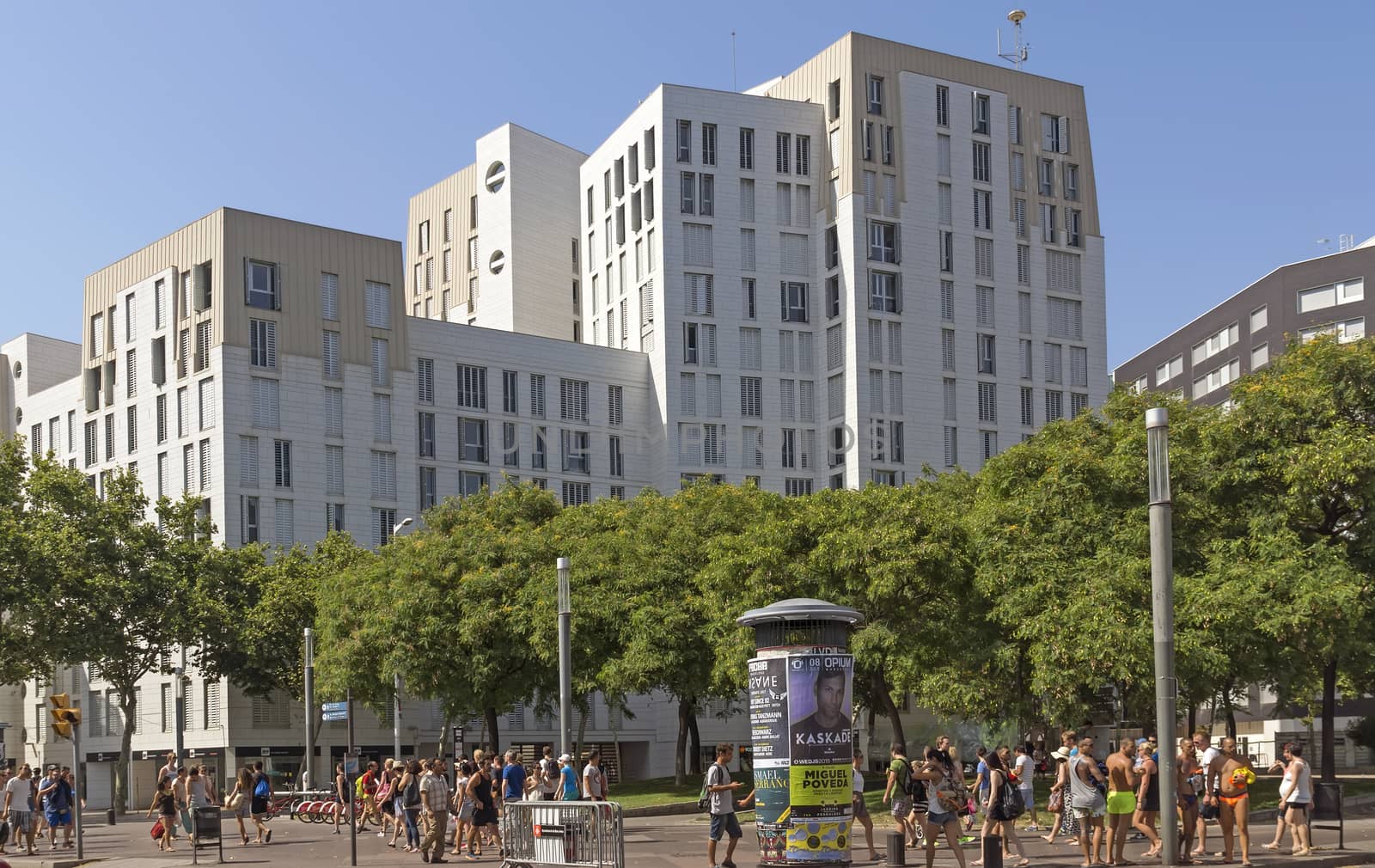 BARCELONA, SPAIN - JULY 4, 2015: New modern architecture in the Diagonal Mar i el Front Maritim del Poblenou area.

Barcelona, Spain - July 4, 2015: New modern architecture in the Diagonal Mar i el Front Maritim del Poblenou area. This is a new booming area with modern buildings. Diagonal Mar - District, built at the end of the past - the beginning of this century. The impetus for its development was the holding in the capital of Catalonia, the World Cultural Forum. Diagonal Mar is famous for its clean and tranquil beaches, upscale apartments and hotels. People are walking by street.