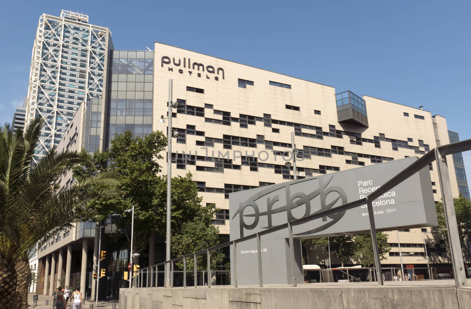 BARCELONA, SPAIN - JULY 4, 2015: Buildings of Pullman Barcelona Skipper Hotel. Hotel located nearby beaches, city center and the Olympic Port.

Barcelona, Spain - July 4, 2015: Buildings of Pullman Barcelona Skipper Hotel. Hotel located nearby beaches, city center and the Olympic Port. People are walking by street.