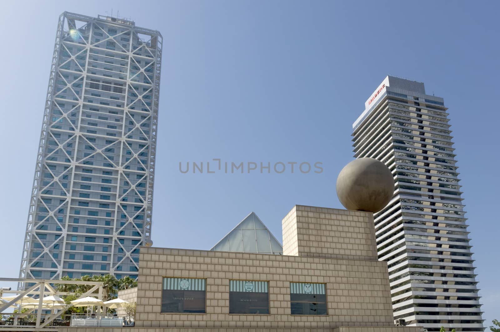 BARCELONA, SPAIN - JULY 4, 2015: Hotel Arts, built by SOM Group, and Tower Mapfre, build by Ortiz-De Leon, both in 1992 in Barcelona, Spain.

Barcelona, Spain - July 4, 2015: Hotel Arts, built by SOM Group, and Tower Mapfre, build by Ortiz-De Leon, both in 1992 in Barcelona, Spain.
