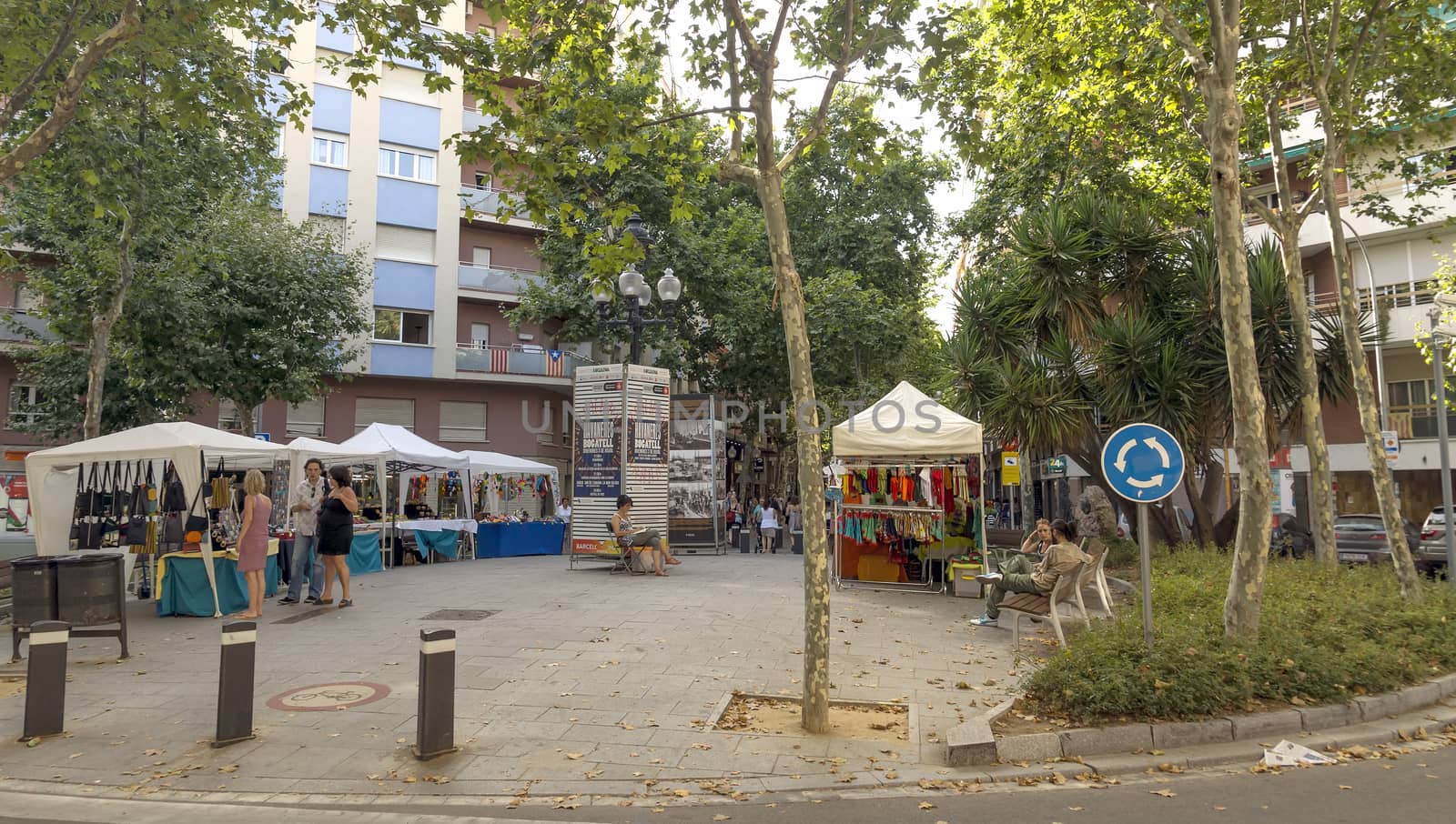 BARCELONA, SPAIN - JULY 5, 2015: Crowded La Rambla street at the heart of Barcelona, Spain.

Barcelona, Spain - July 5, 2015: Crowded La Rambla street at the heart of Barcelona, Spain. People are walking by street.