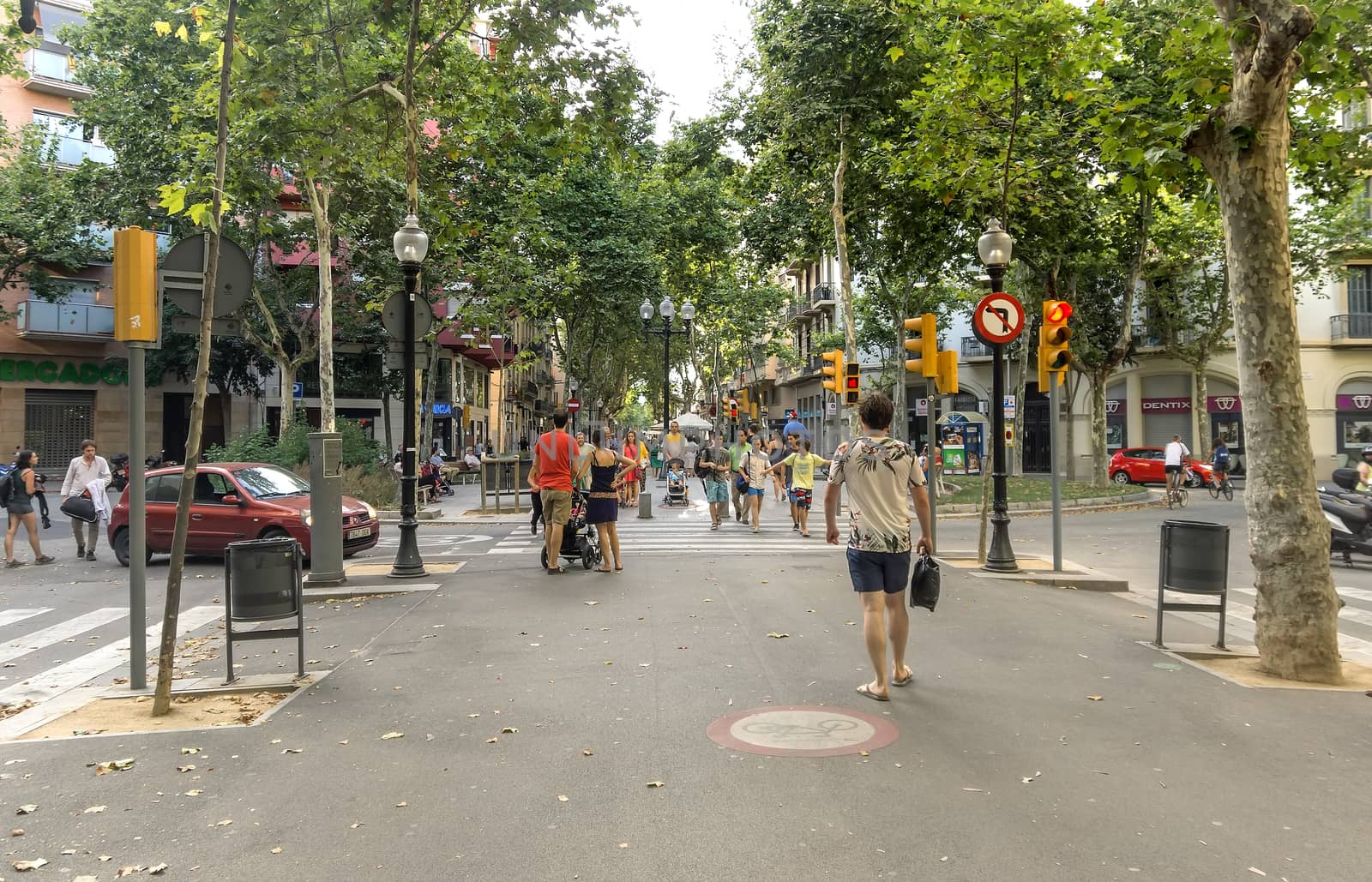 BARCELONA, SPAIN - JULY 5, 2015: Crowded La Rambla street at the heart of Barcelona, Spain.

Barcelona, Spain - July 5, 2015: Crowded La Rambla street at the heart of Barcelona, Spain. People are walking by street.