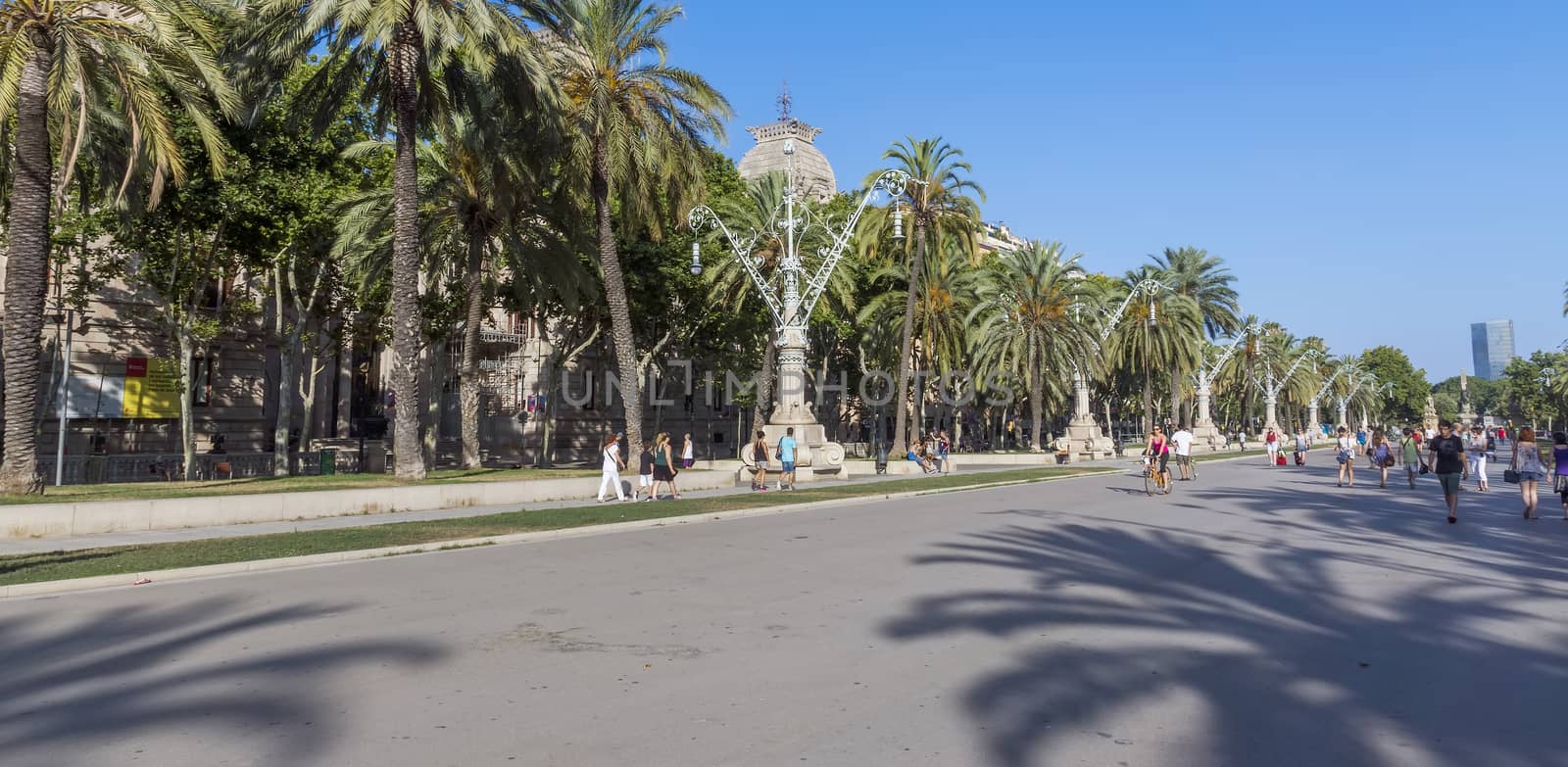 BARCELONA, SPAIN - JULY 8, 2015: Promenade leading to the Parc de la Ciutadella in Barcelona.

Barcelona, Spain - July 8, 2015: Promenade leading to the Parc de la Ciutadella in Barcelona. People are walking by promenade.