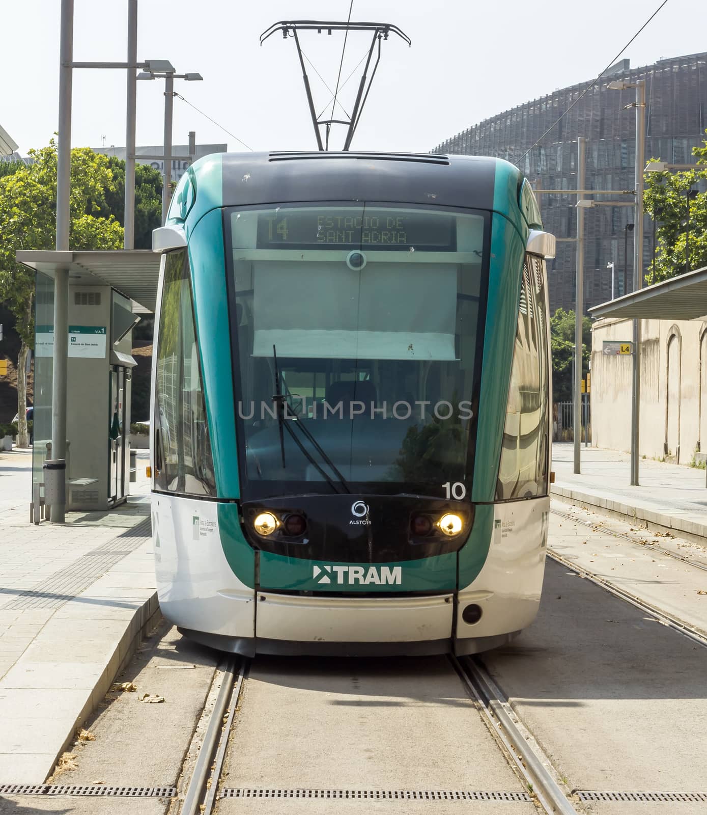 BARCELONA, SPAIN - JULY 12, 2015: Barcelona tram known as Trambaix. The tram is going through the Diagonal avenue.

Barcelona, Spain - July 12, 2015: Barcelona tram known as Trambaix. The tram is going through the Diagonal avenue.