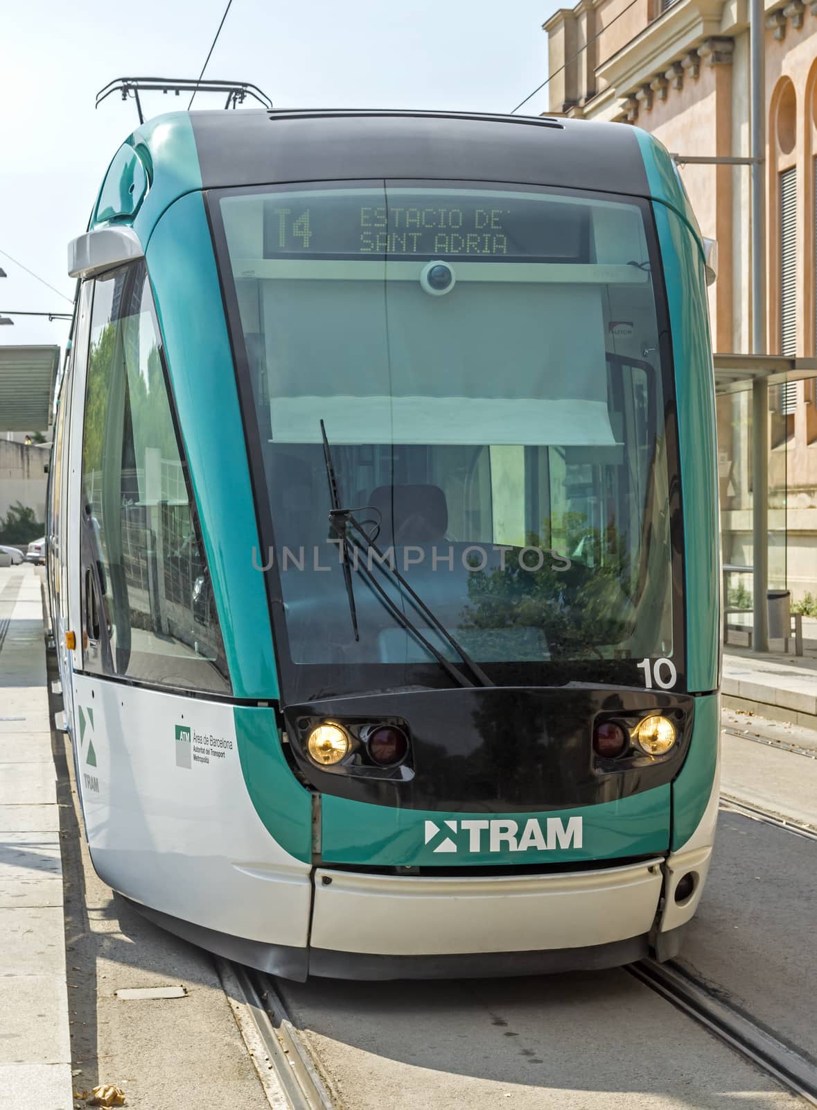 BARCELONA, SPAIN - JULY 12, 2015: Barcelona tram known as Trambaix. The tram is going through the Diagonal avenue.

Barcelona, Spain - July 12, 2015: Barcelona tram known as Trambaix. The tram is going through the Diagonal avenue.