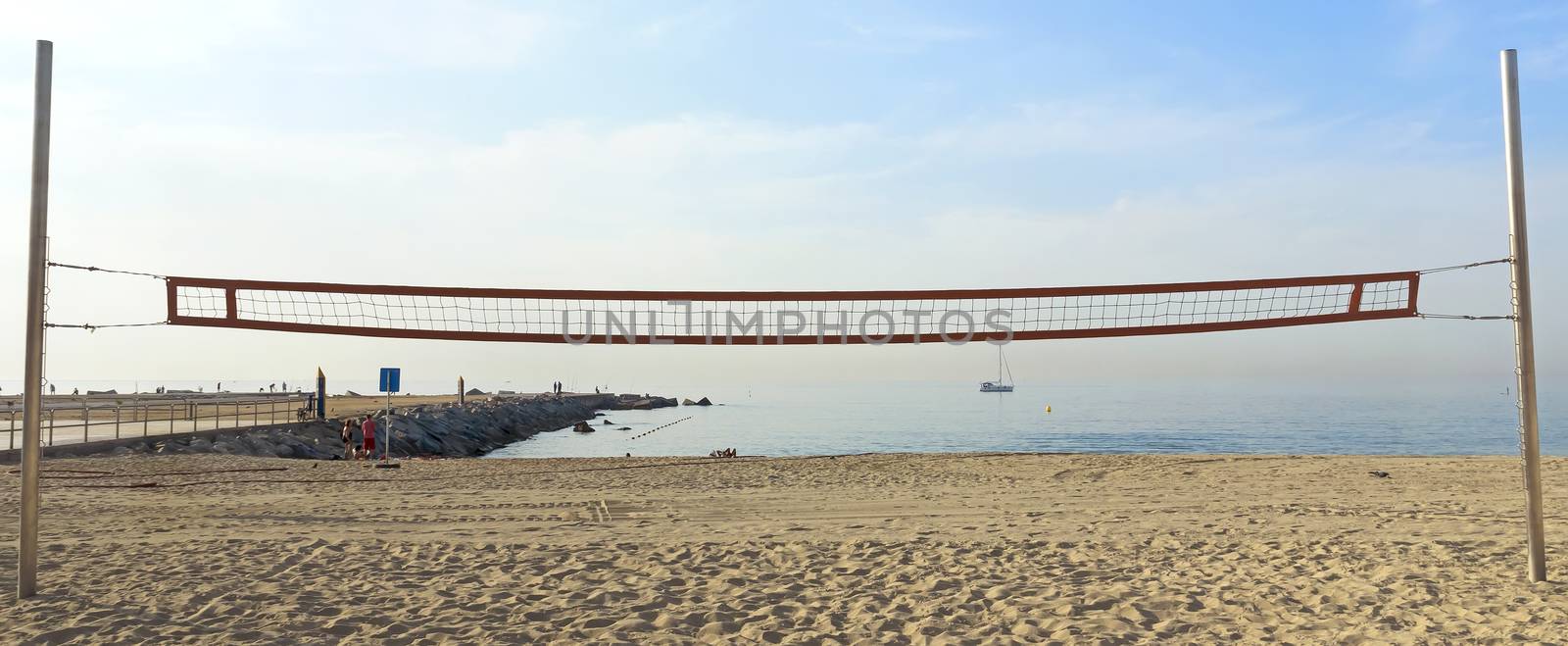 A volleyball net on the beach early in the morning