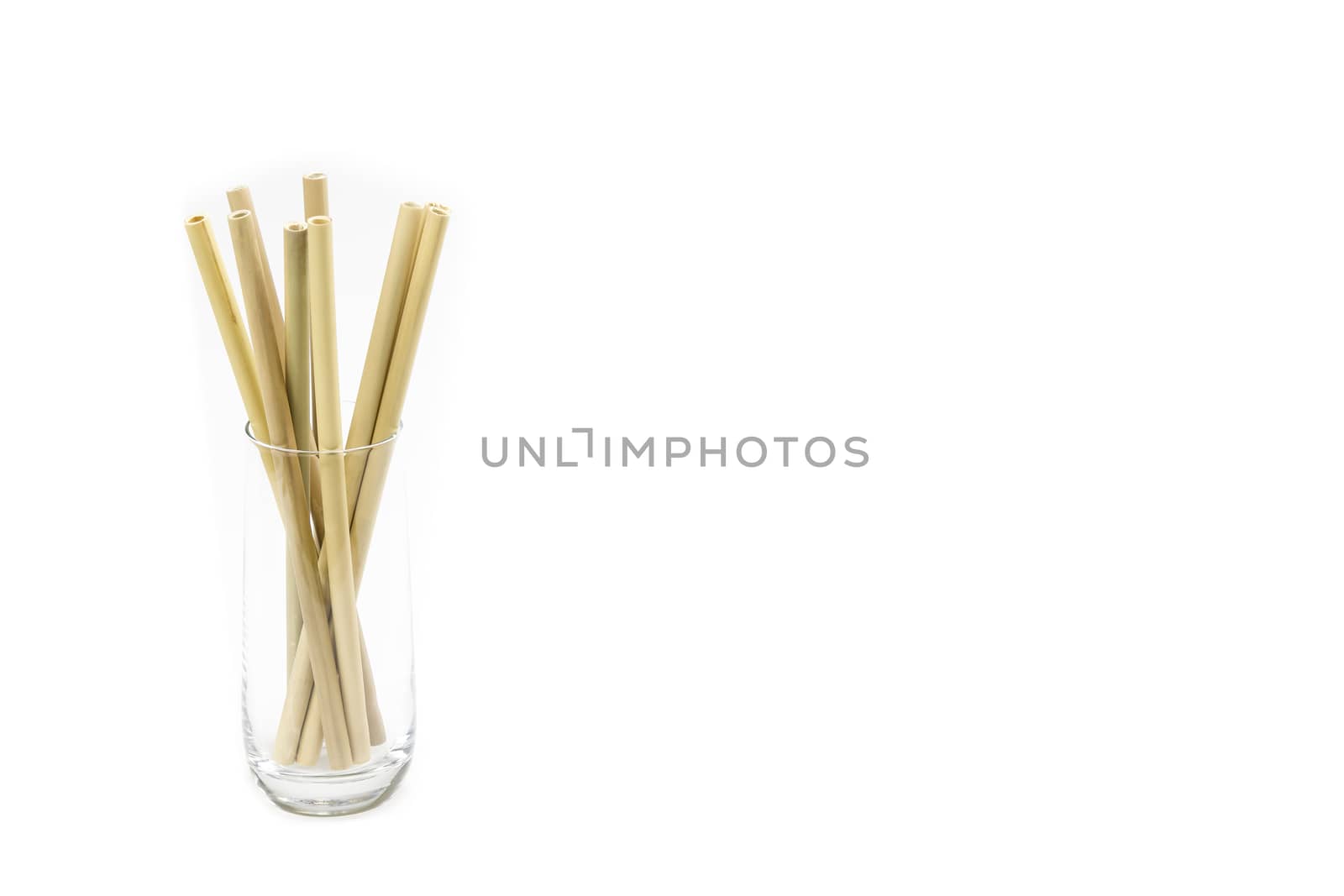 Eco-friendly Bamboo drinking straws against white background and large copy space (no to plastic concept)