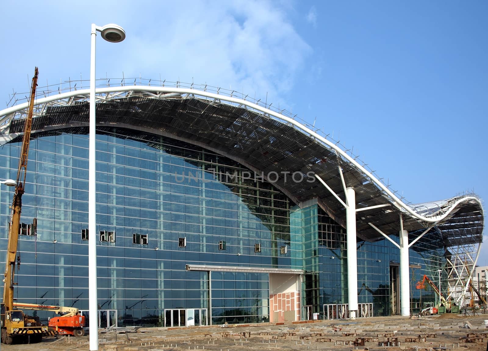 KAOHSIUNG, TAIWAN - JUNE 30: Construction continues on the new Kaohsiung Exhibition and Convention Center, scheduled to open in early 2014, on June 30, 2013 in Kaohsiung