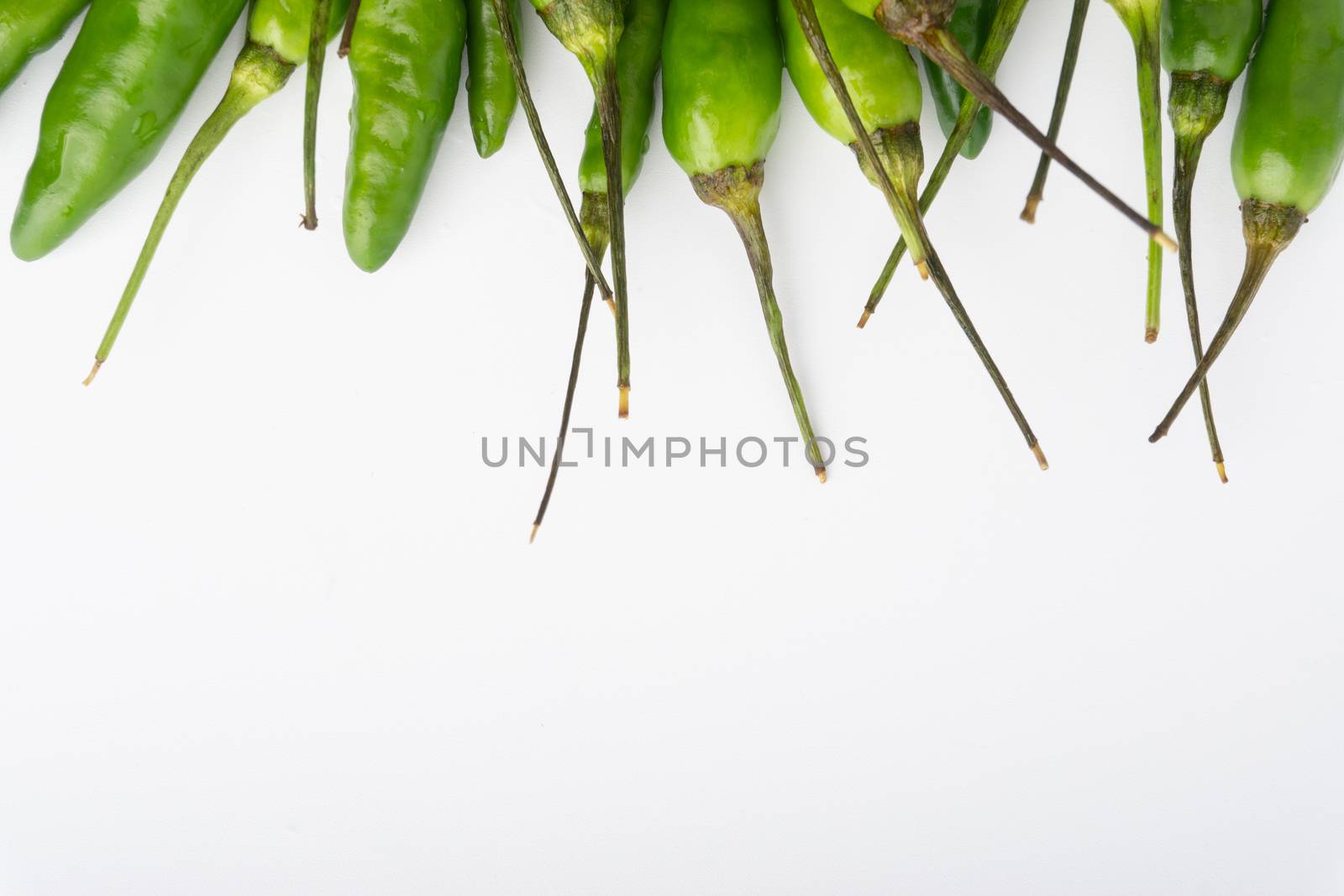 Green BirdÕs eye chili,Thai Chili pepper ,bird chili pepper nature isolate on white background. Selective focus and crop fragment