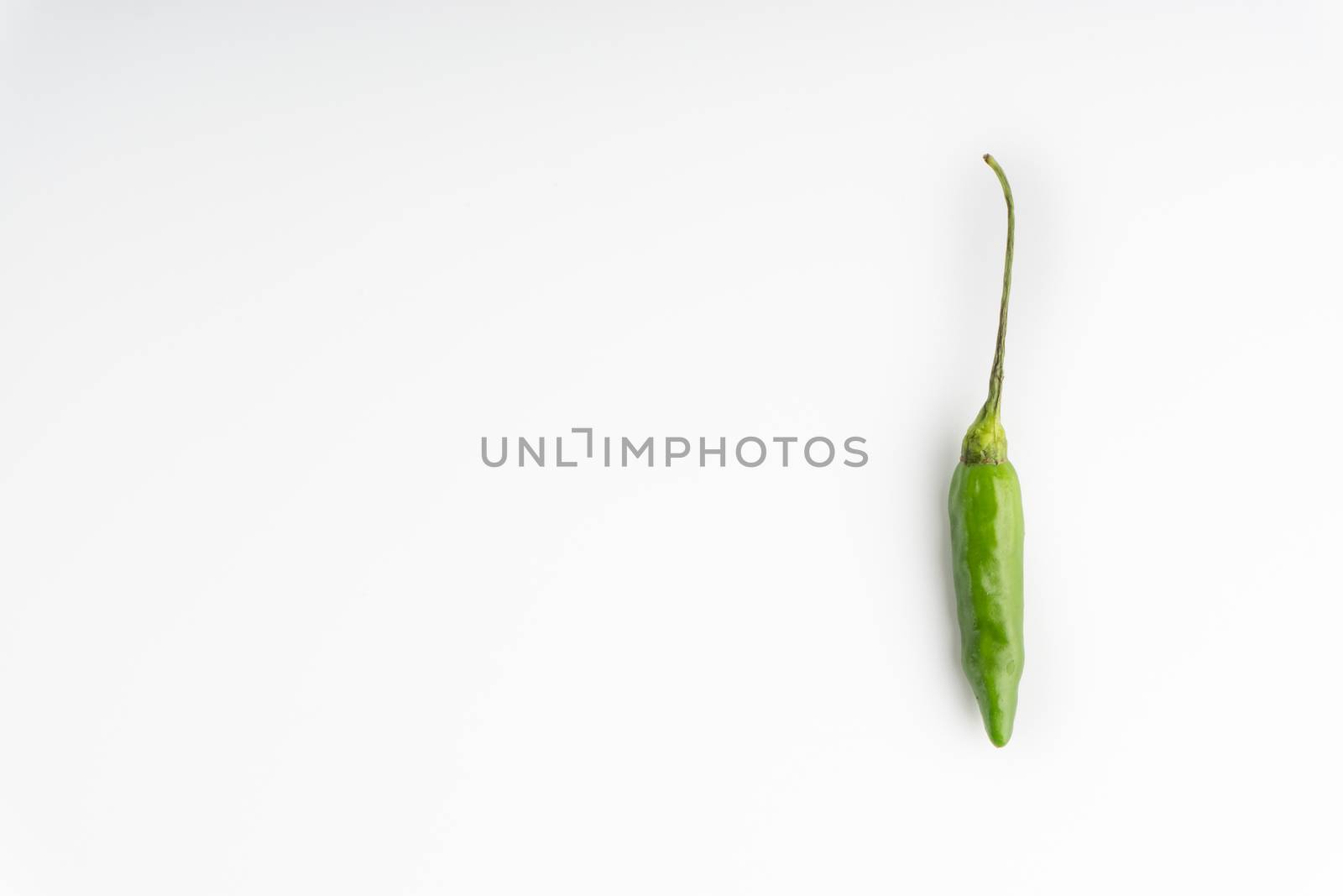 Green BirdÕs eye chili,Thai Chili pepper ,bird chili pepper nature isolate on white background. Selective focus and crop fragment