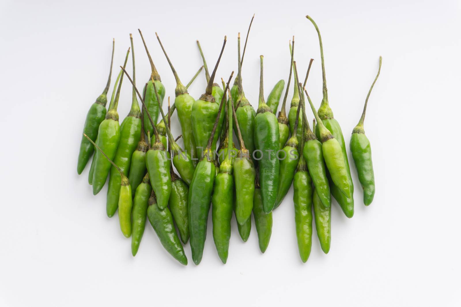 Green BirdÕs eye chili,Thai Chili pepper ,bird chili pepper nature isolate on white background. Selective focus and crop fragment