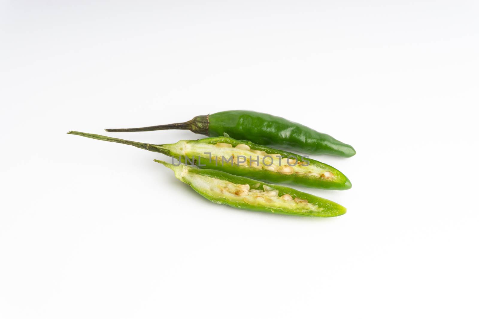 Green BirdÕs eye chili,Thai Chili pepper ,bird chili pepper nature isolate on white background. Selective focus and crop fragment