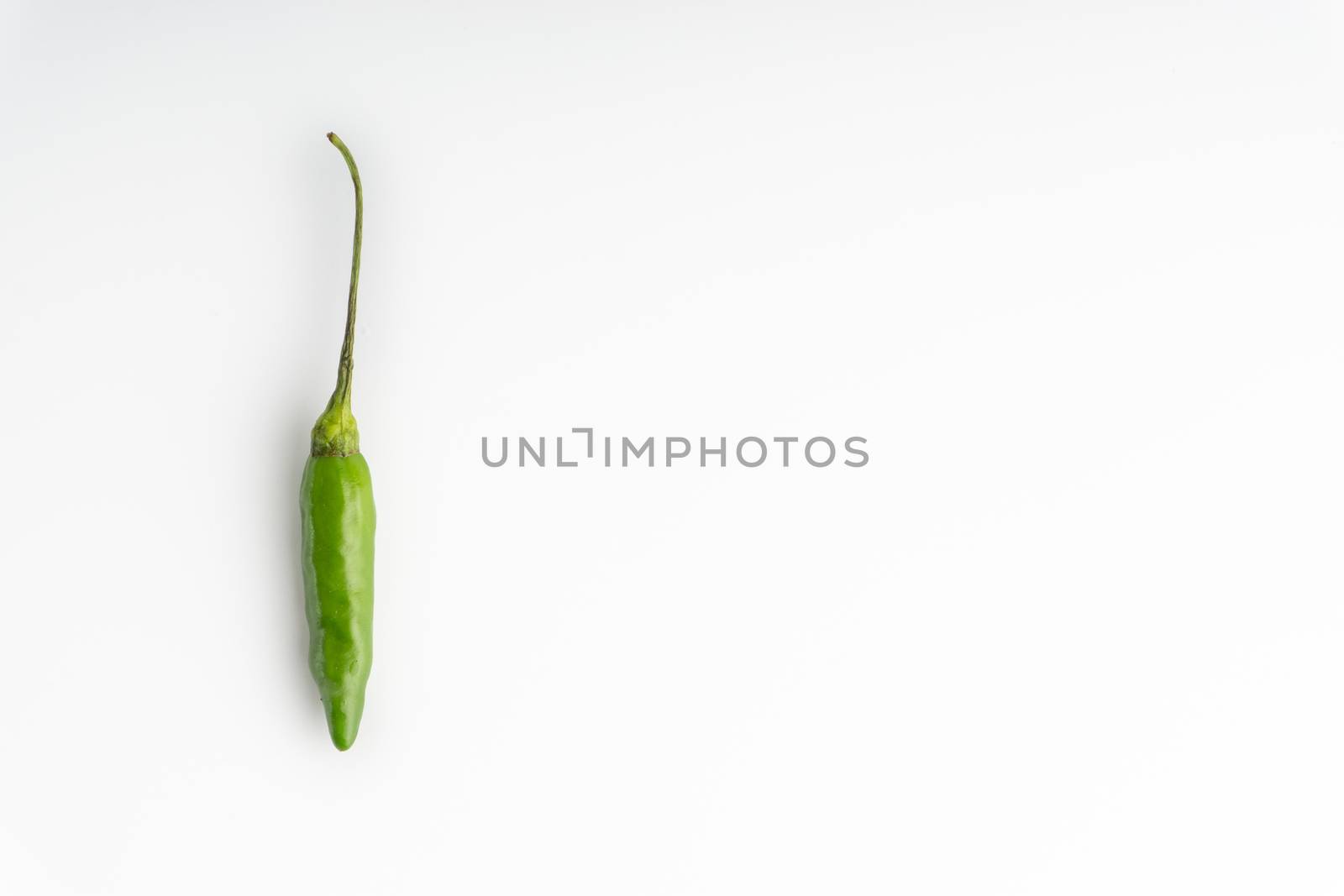 Green BirdÕs eye chili,Thai Chili pepper ,bird chili pepper nature isolate on white background. Selective focus and crop fragment