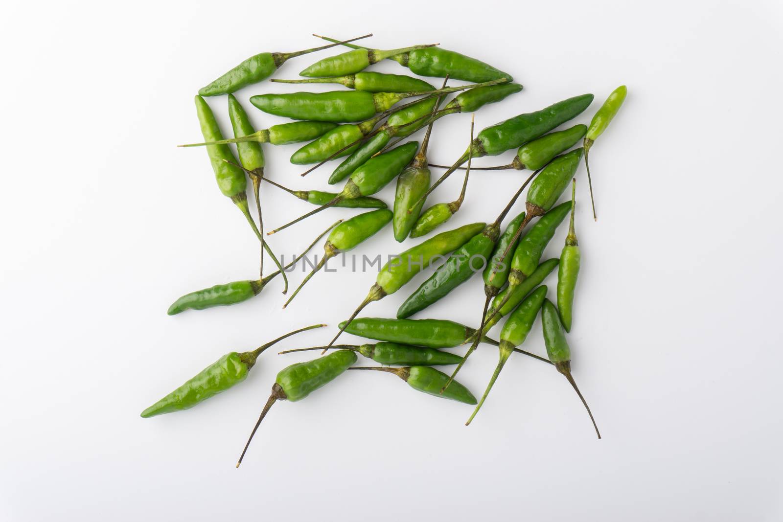 Green BirdÕs eye chili,Thai Chili pepper ,bird chili pepper nature isolate on white background. Selective focus and crop fragment