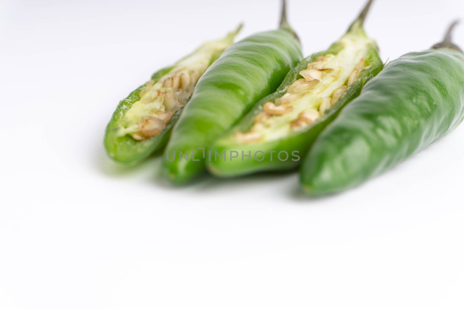 Green BirdÕs eye chili,Thai Chili pepper ,bird chili pepper nature isolate on white background. Selective focus and crop fragment