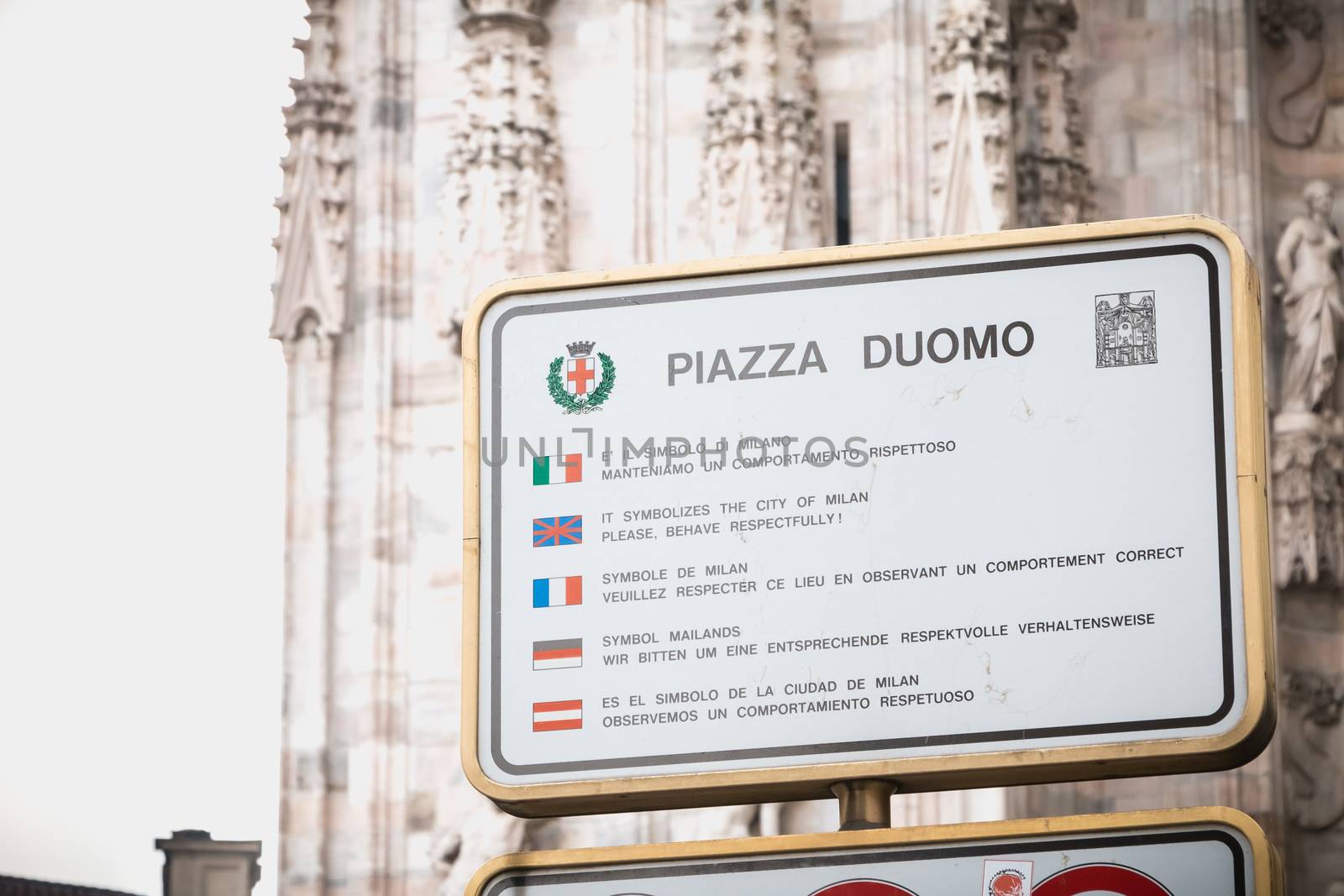 Duomo Square, a sign asks visitors to respect the place by obser by AtlanticEUROSTOXX