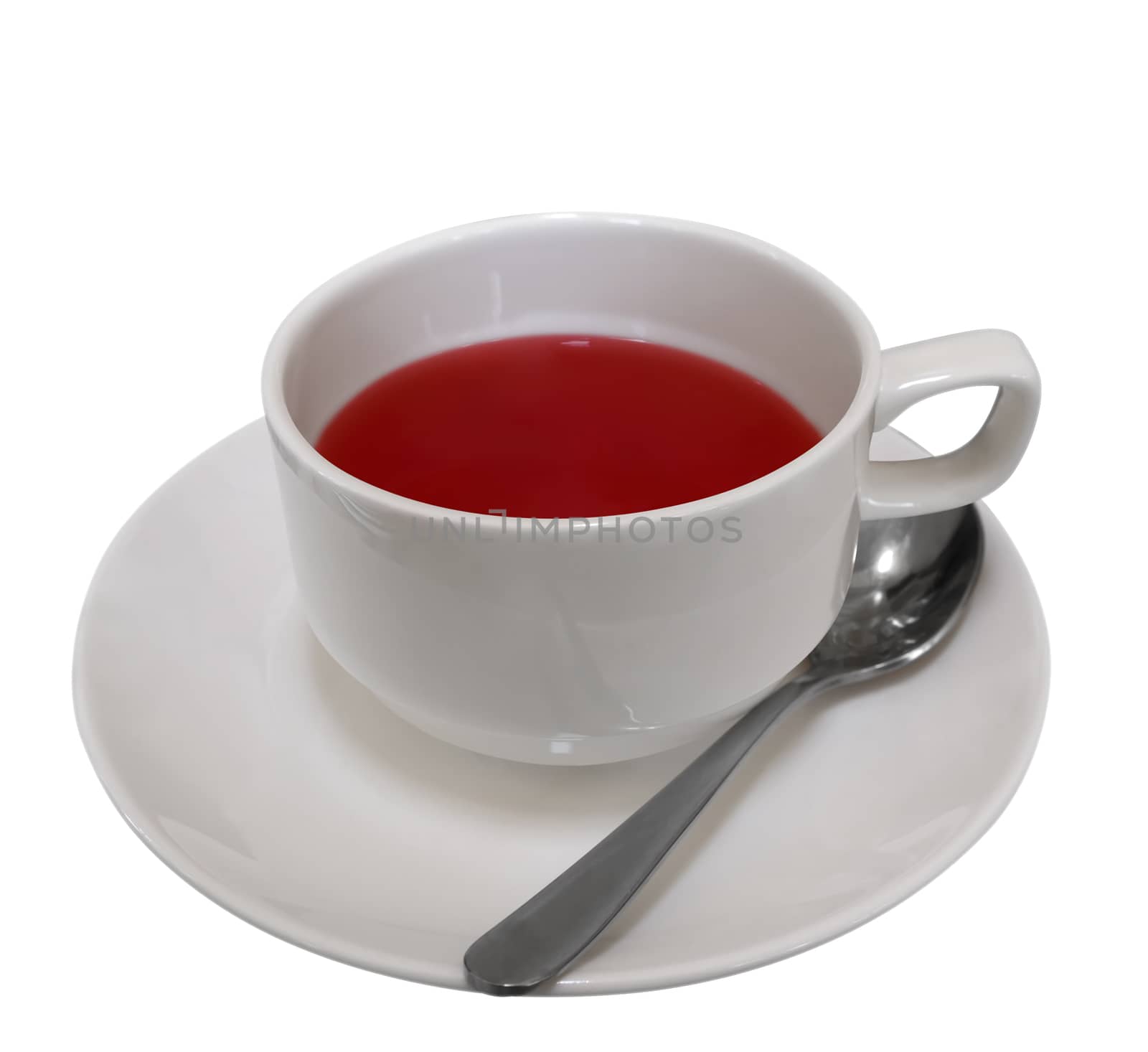 Cup of red fruit tea isolated on white. Clipping path included.