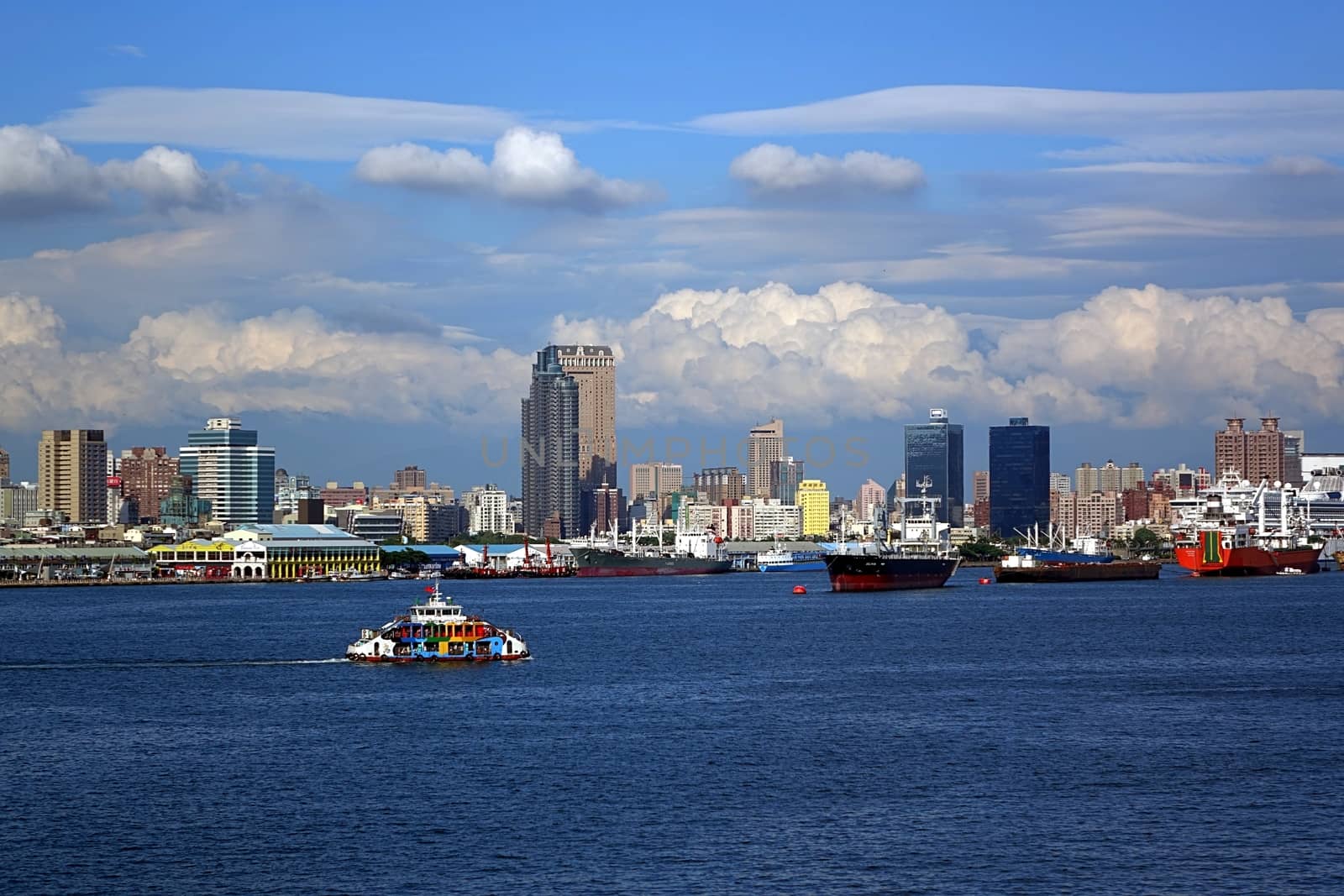 KAOHSIUNG, TAIWAN -- MAY 11, 2014: A panoramic view of Kaohsiung city and port with the cross-harbor ferry in the foreground