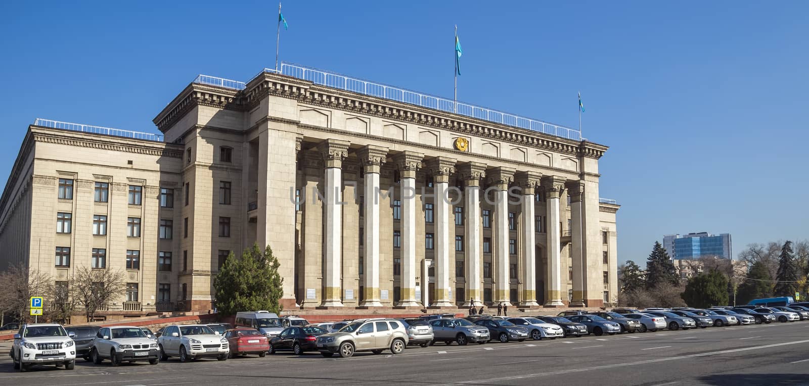 ALMATY, KAZAKHSTAN - OCTOBER 20, 2015: Old Government House in Almaty, Kazakhstan.

Almaty, Kazakhstan - October 20, 2015: Old Government House in Almaty, Kazakhstan. People are standing near the building.