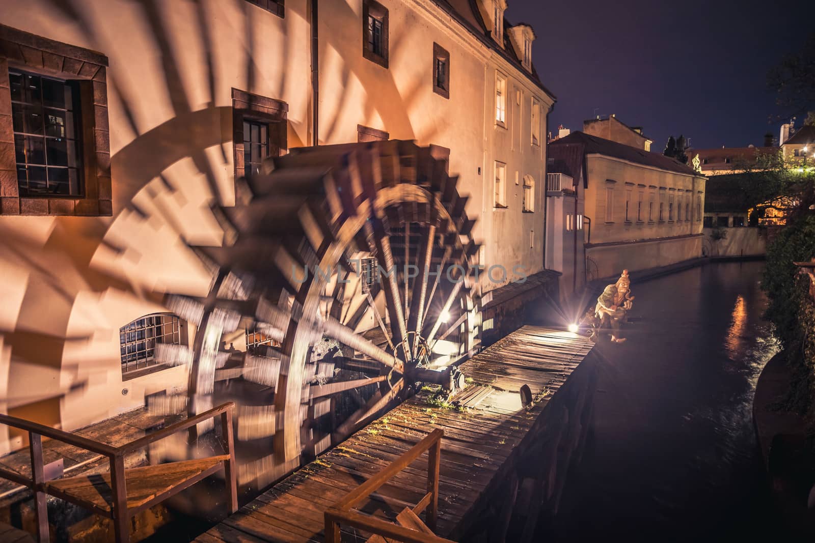 Historic water mill on Kampa Island in Prague, Czech Republic. Branch of the Vltava river, the Certovka or Devil's Stream