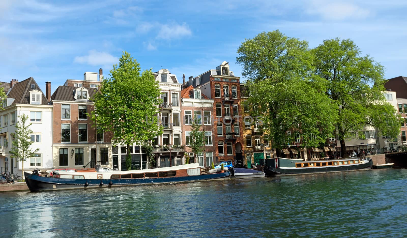 View of Amsterdam canals and typical dutch houses. Holland.