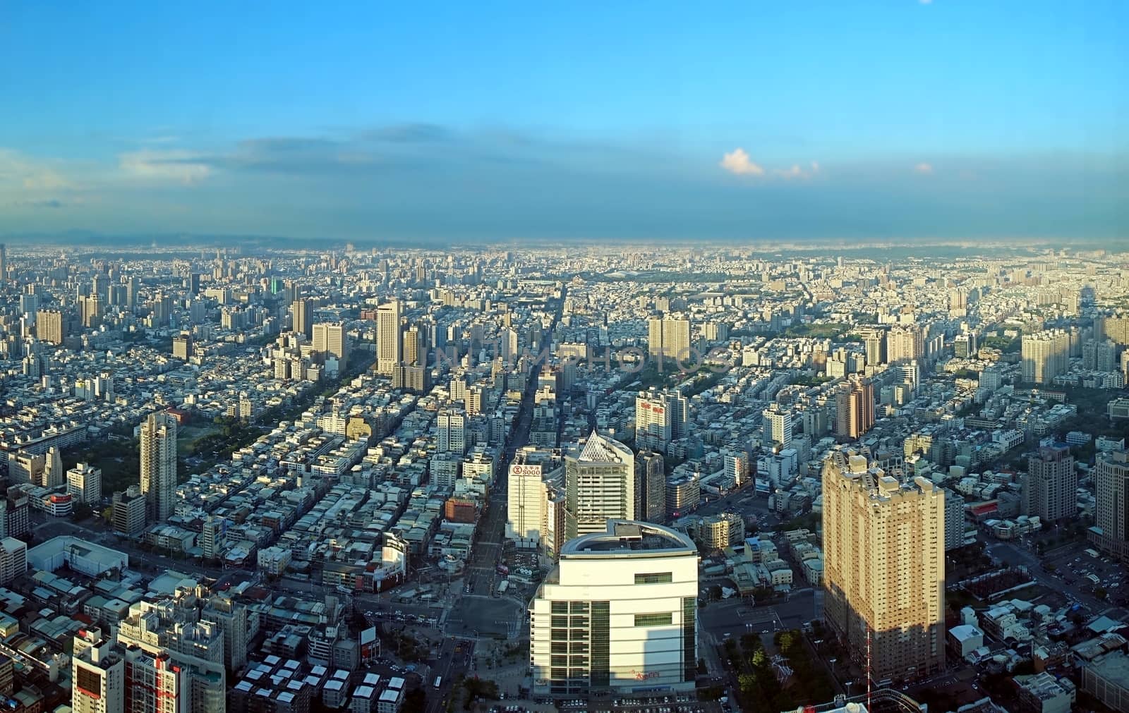 KAOHSIUNG, TAIWAN -- JULY 13, 2014:  A birds eye view of Kaohsiung City in Taiwan from west to east