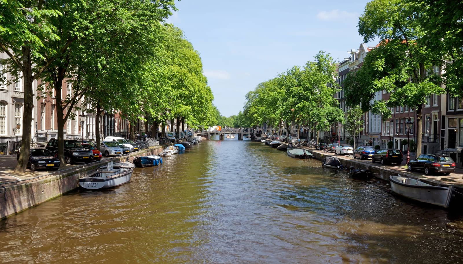 AMSTERDAM, NETHERLANDS - MAY 30: Amsterdam canals on May 30, 2014 in Amsterdam, Netherlands. View of Amsterdam canals and typical dutch houses.

Amsterdam, Netherlands - May 30, 2014: View of Amsterdam canals and typical dutch houses.