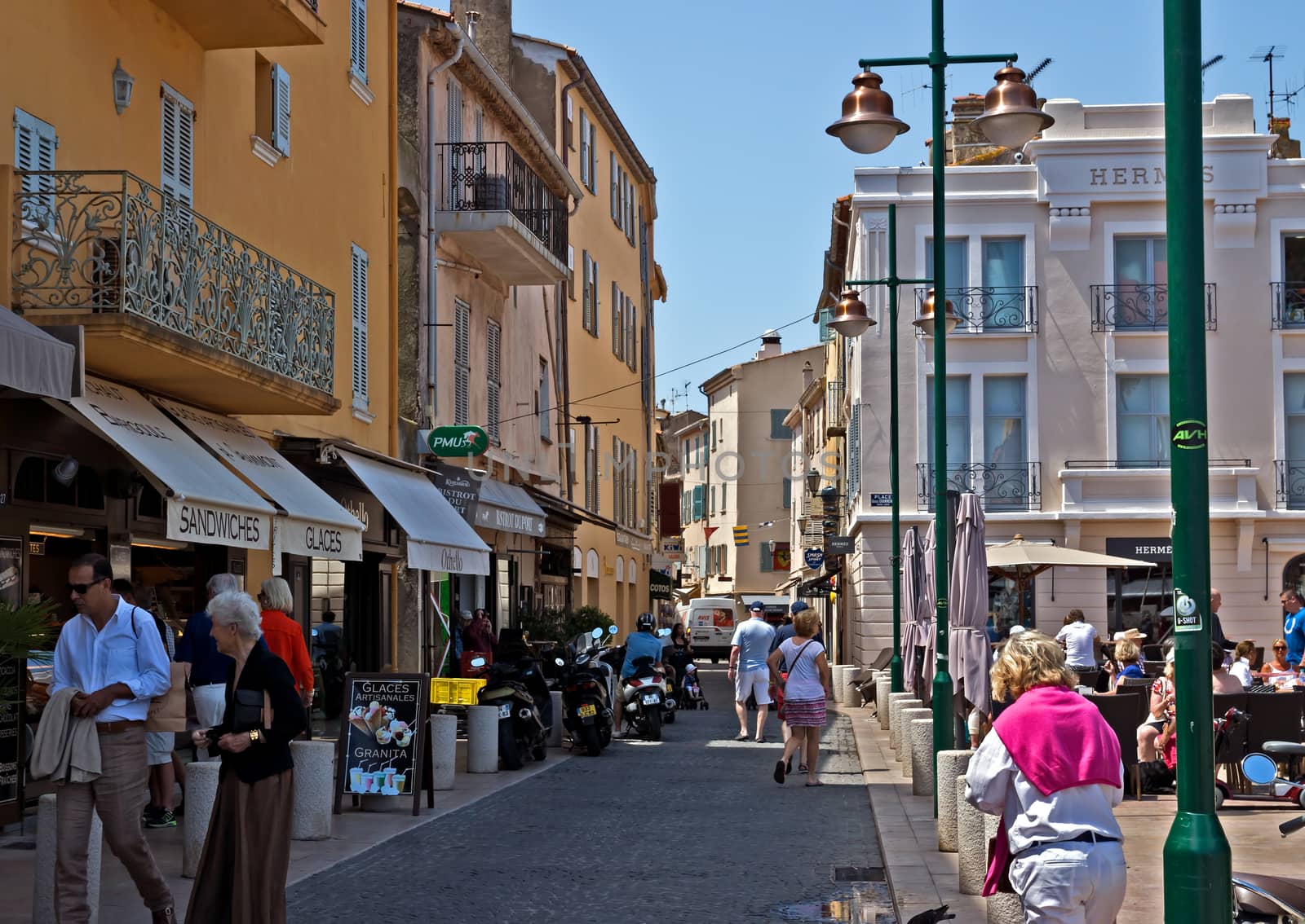 SAINT TROPEZ, FRANCE - JUNE 5, 2014: Architecture of Saint Tropez city in French Riviera, France.

Saint Tropez, France - June 5, 2014: Architecture of Saint Tropez city in French Riviera, France. People are walking by street.