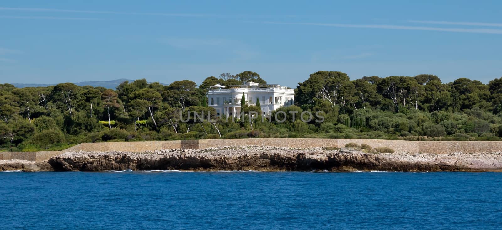 ANTIBES, FRANCE - JUNE 5, 2014: A luxury villa on the shores of the Mediterranean Sea.

Antibes, France - June 5, 2014: A luxury villa on the shores of the Mediterranean Sea.