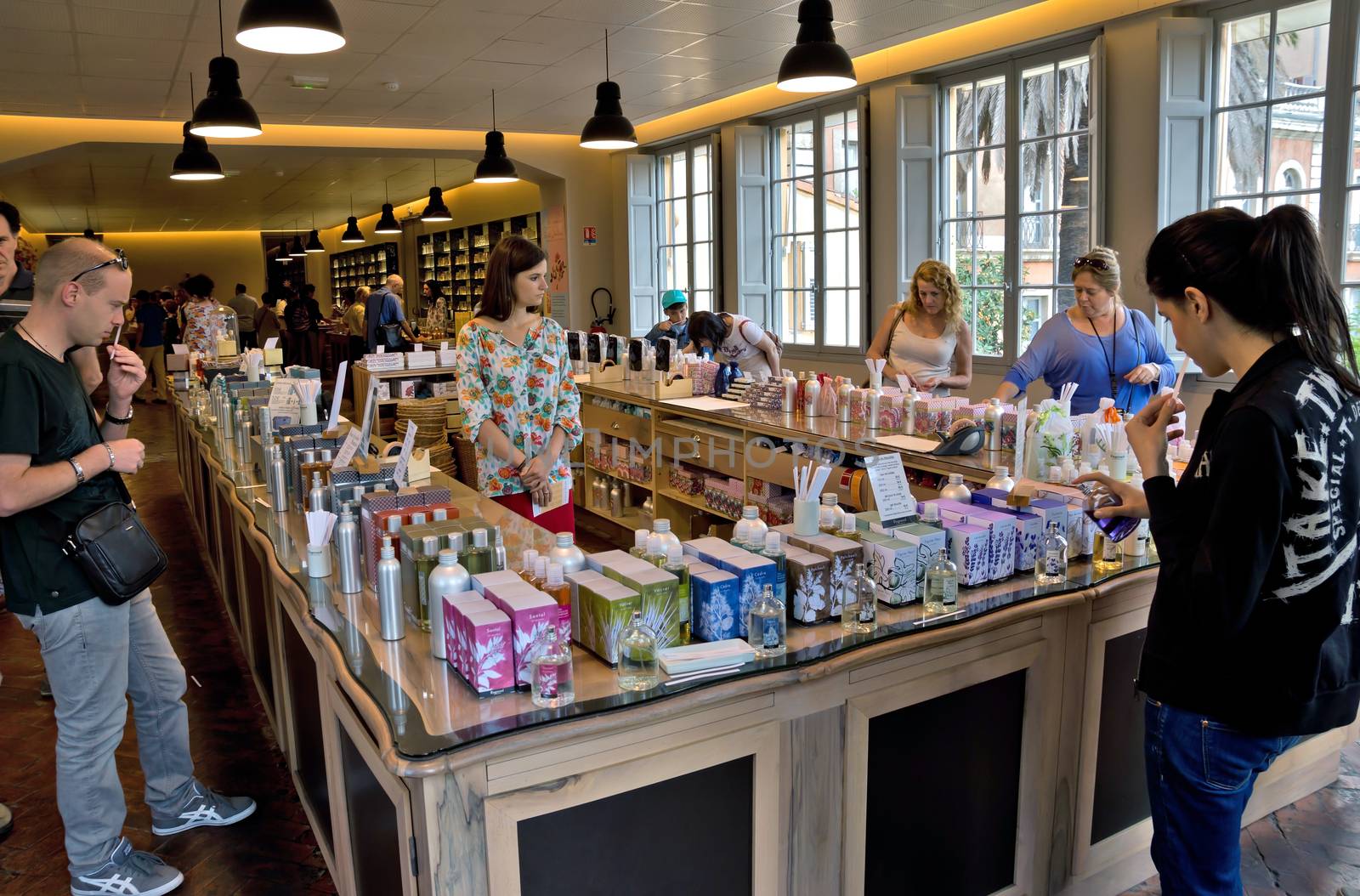 GRASSE, FRANCE - JUNE 2, 2014: Perfume Shop inside Fragonard factory. People choose and buy perfume. Fragonard perfumery is one of the older factory in the world capital of perfumes.

Grasse, France - June 2, 2014: Perfume Shop inside Fragonard factory. People choose and buy perfume. Fragonard perfumery is one of the older factory in the world capital of perfumes.