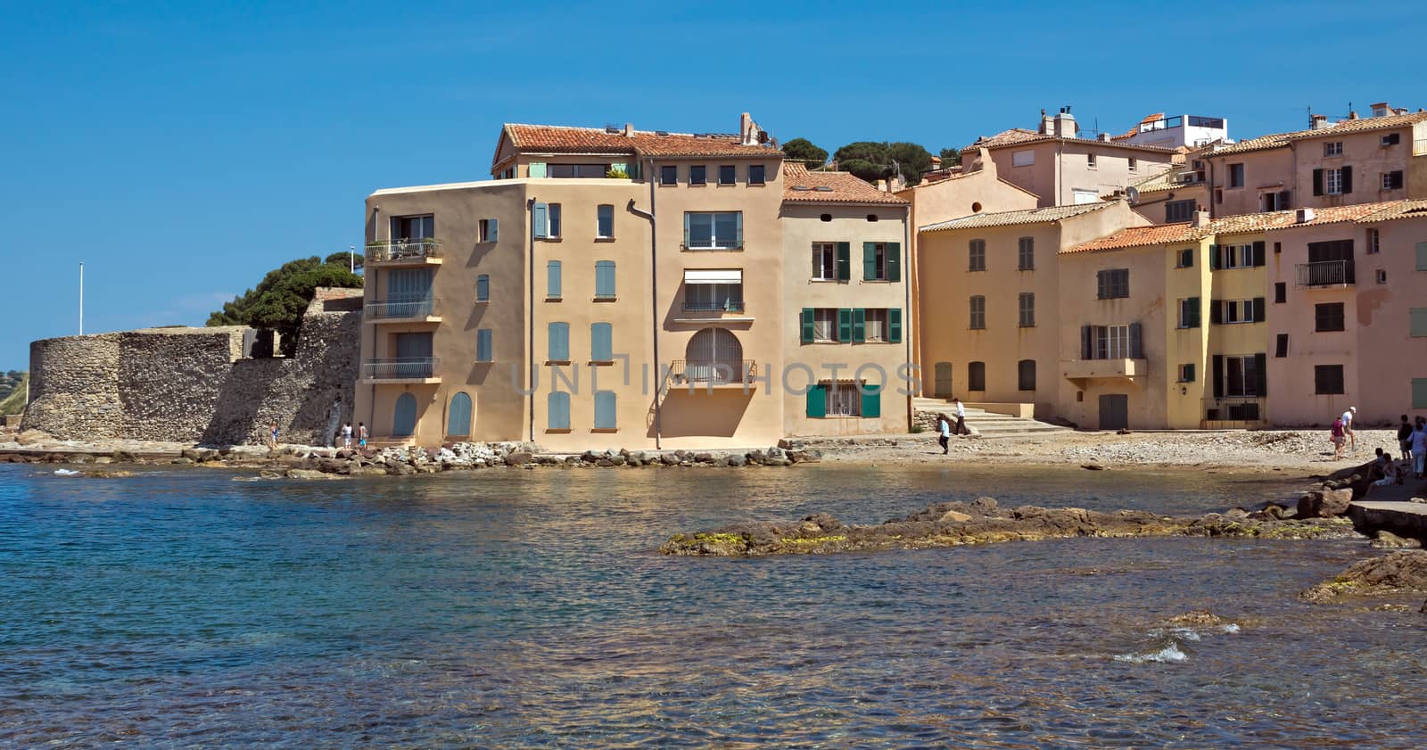 SAINT TROPEZ, FRANCE - JUNE 5, 2014: Architecture of Saint Tropez on the cote d'azur.

Saint Tropez, France - June 5, 2014: Architecture of Saint Tropez on the cote d'azur. People are walking by coast.