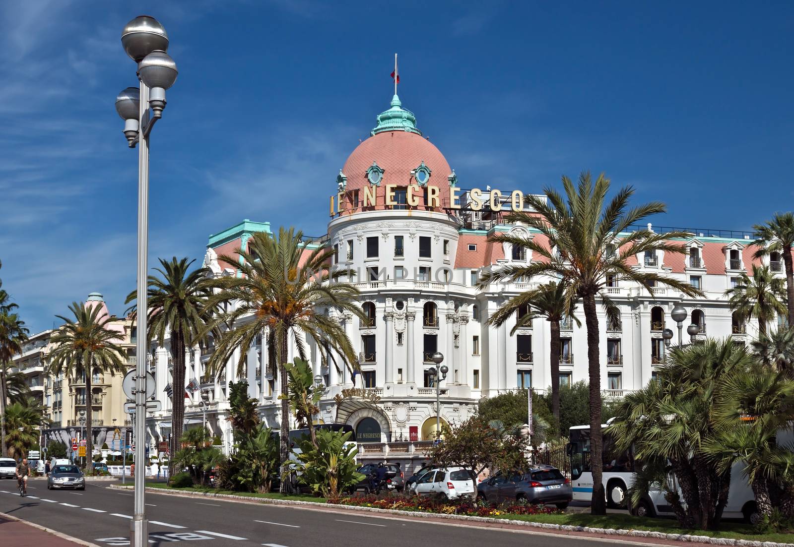 NICE, FRANCE - JUNE 6, 2014: Luxury Hotel Negresco on English Promenade in Nice, French Riviera. Hotel Negresco is the famous luxury hotel on the Promenade des Anglais in Nice, a symbol of the Cote d'Azur.

Nice, France - June 6, 2014: Luxury Hotel Negresco on English Promenade in Nice, French Riviera. Hotel Negresco is the famous luxury hotel on the Promenade des Anglais in Nice, a symbol of the Cote d'Azur.