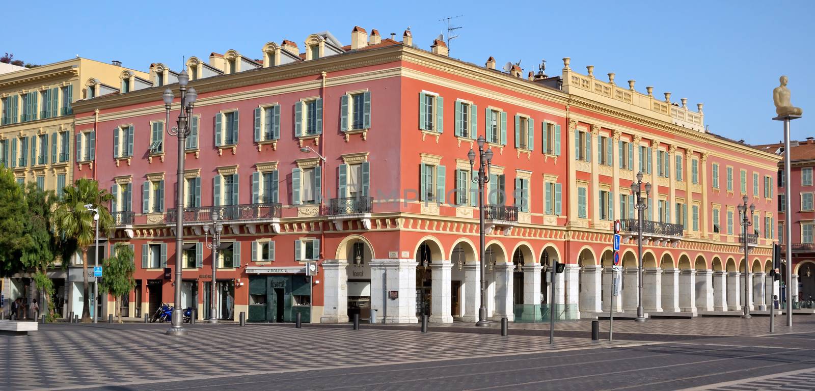 NICE, FRANCE - JUNE 8, 2014: Architecture of the Place Massena. Square is located in the city center and is the most popular destination among tourists. The square was reconstructed in 1979.

Nice, France - June 8, 2014: Architecture of the Place Massena. Square is located in the city center and is the most popular destination among tourists. The square was reconstructed in 1979. There are many boutiques, cafes and restaurants.